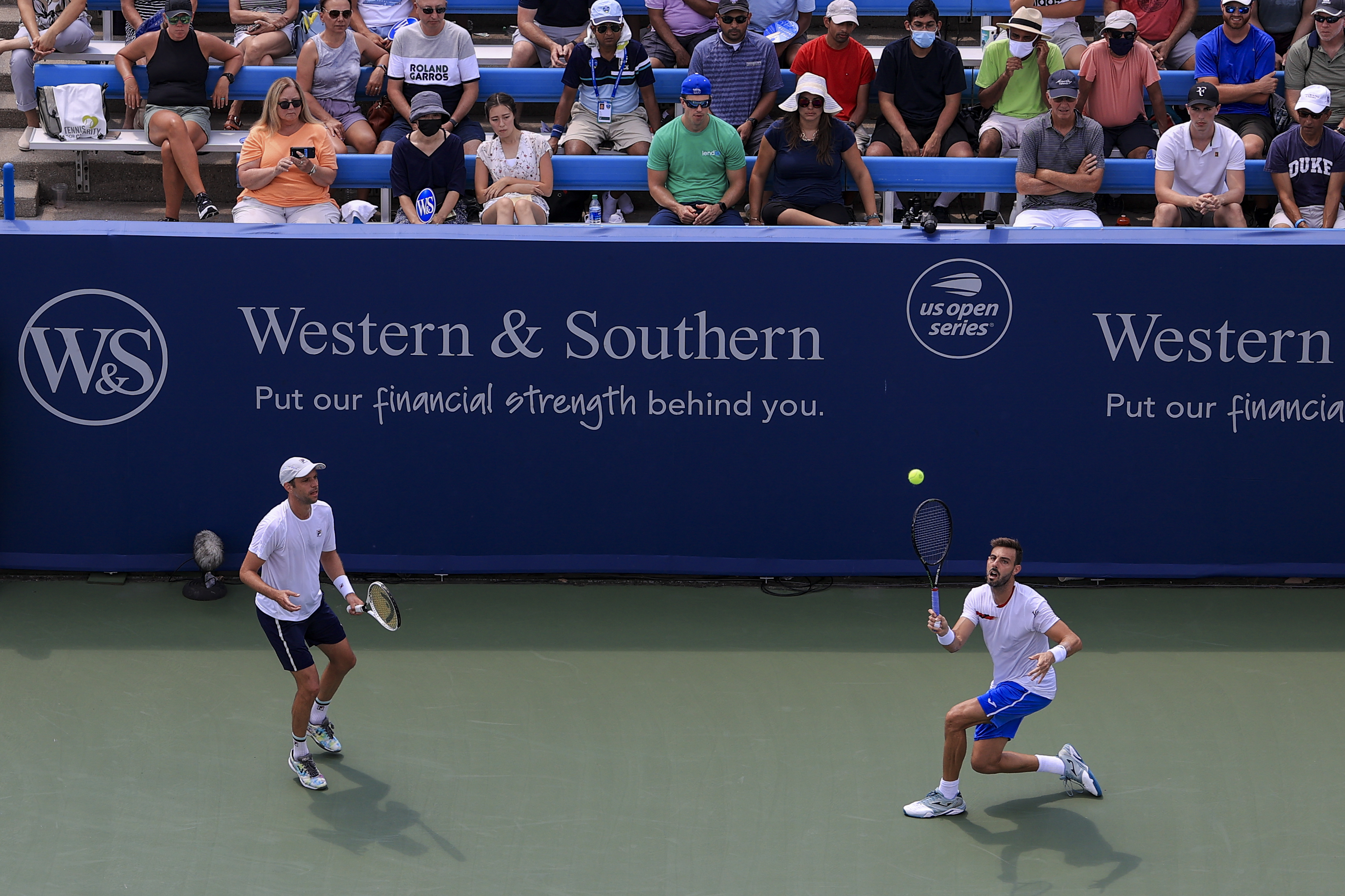 Marcel Granollers, right, of Spain, and Horacio Zeballos, left, of Argentina, play Steve Johnson and Austin Krajicek during the men's double final of the Western & Southern Open tennis tournament Sunday, Aug. 22, 2021, in Mason, Ohio. (AP Photo/Aaron Doster)