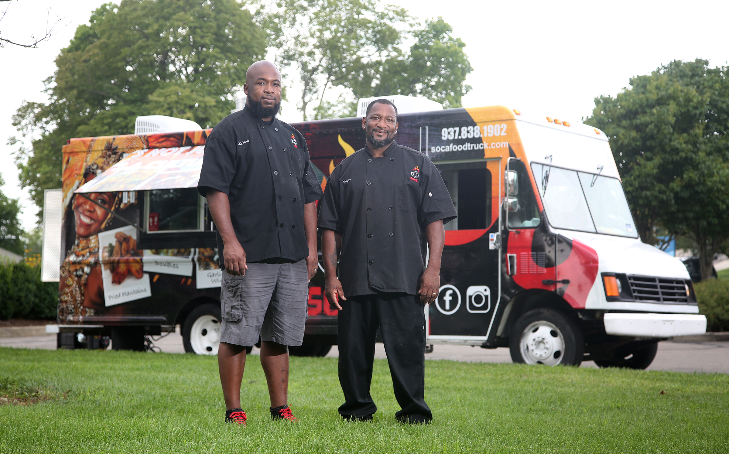 Ricardo Modeste (left) and his brother, Shafton Greene were born in Trinidad and Tobago and have incorporated their heritage into their business, Soca food trucK. LISA POWELL / STAFF