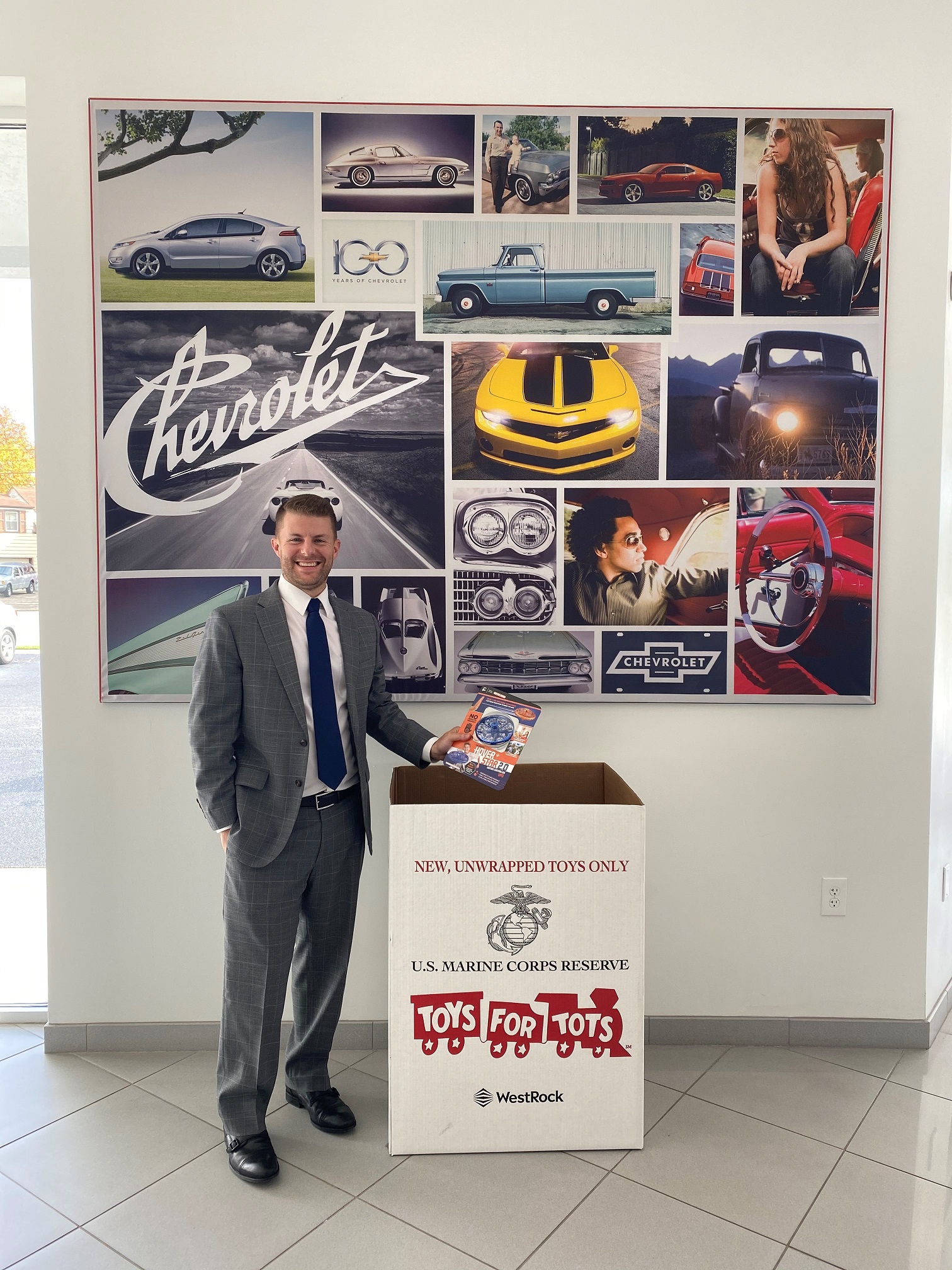 Jeff Schmitt Auto Group has been collecting for Toys for Tots since 2001. Jay Schmitt stands next to a collection box. CONTRIBUTED