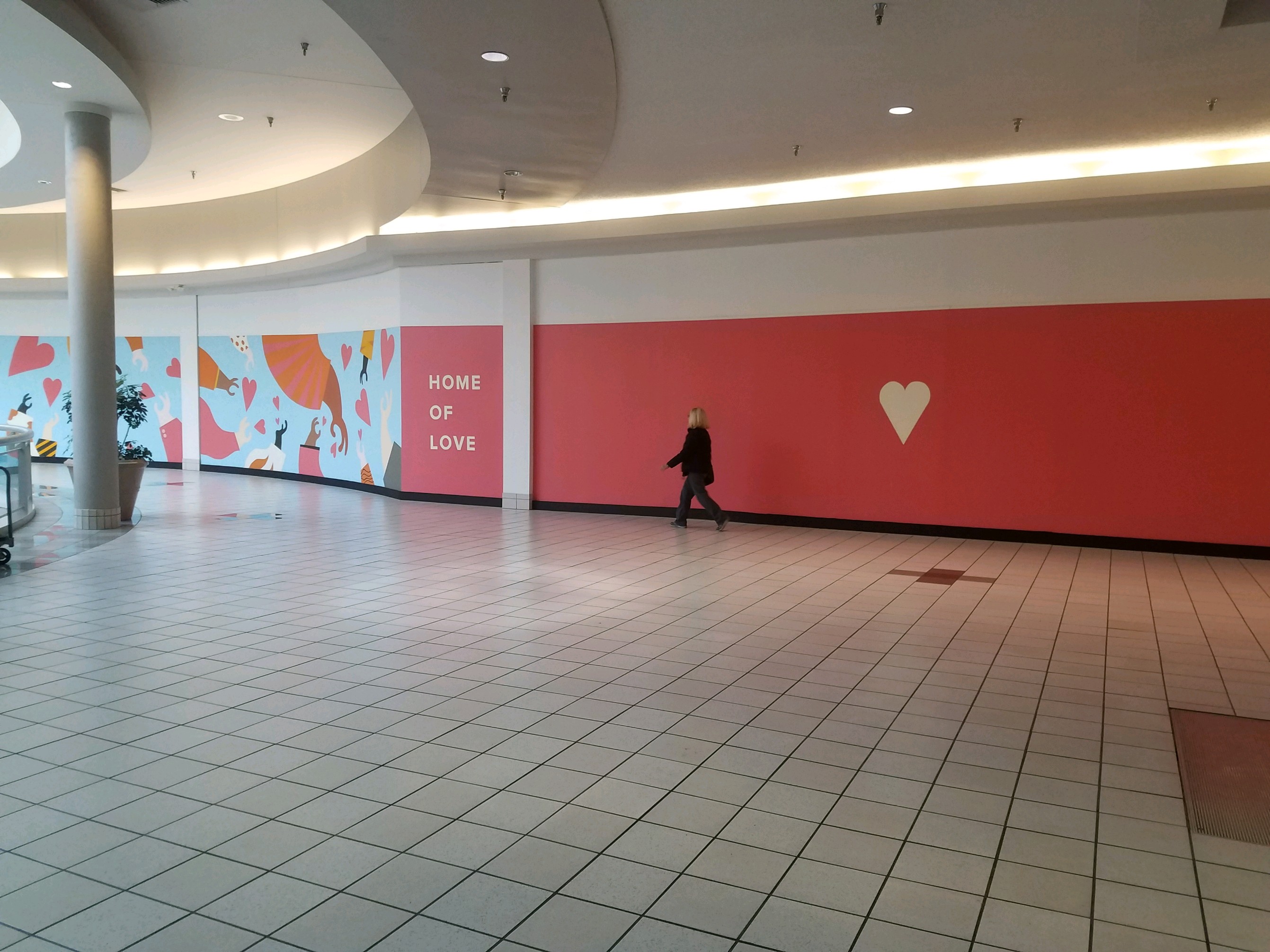 A new mural at the Dayton Mall, "Love of Home," is hoping to inspire residents of Dayton to give love after the tragedies of the previous year.