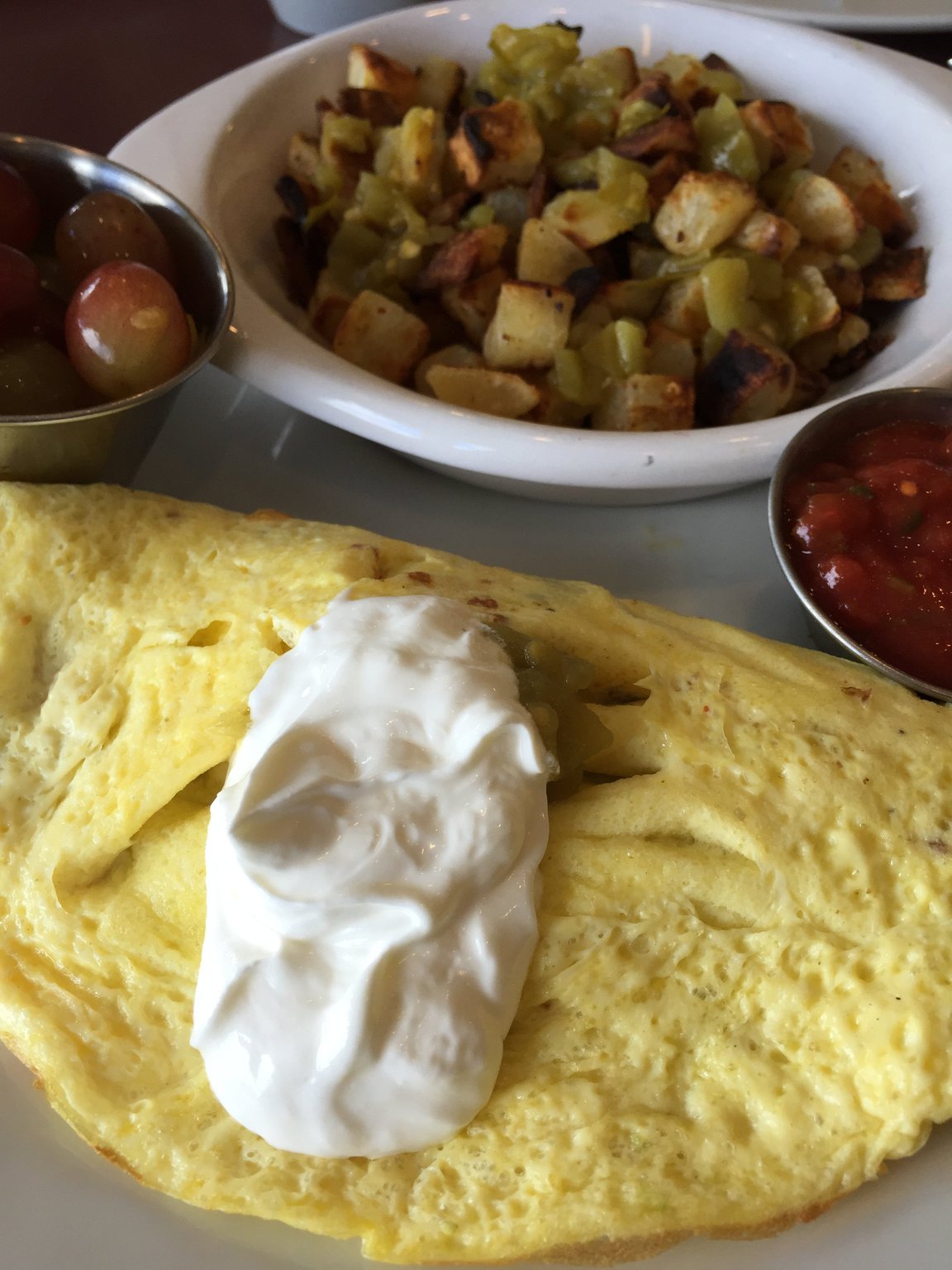 The Acapulco Express omelet made with chorizo sausage, avocado, green chillies, roasted onions, cheddar and Monterey jack, served with a side of home fries, is a dish with a kick. Contributed photo by Alexis Larsen