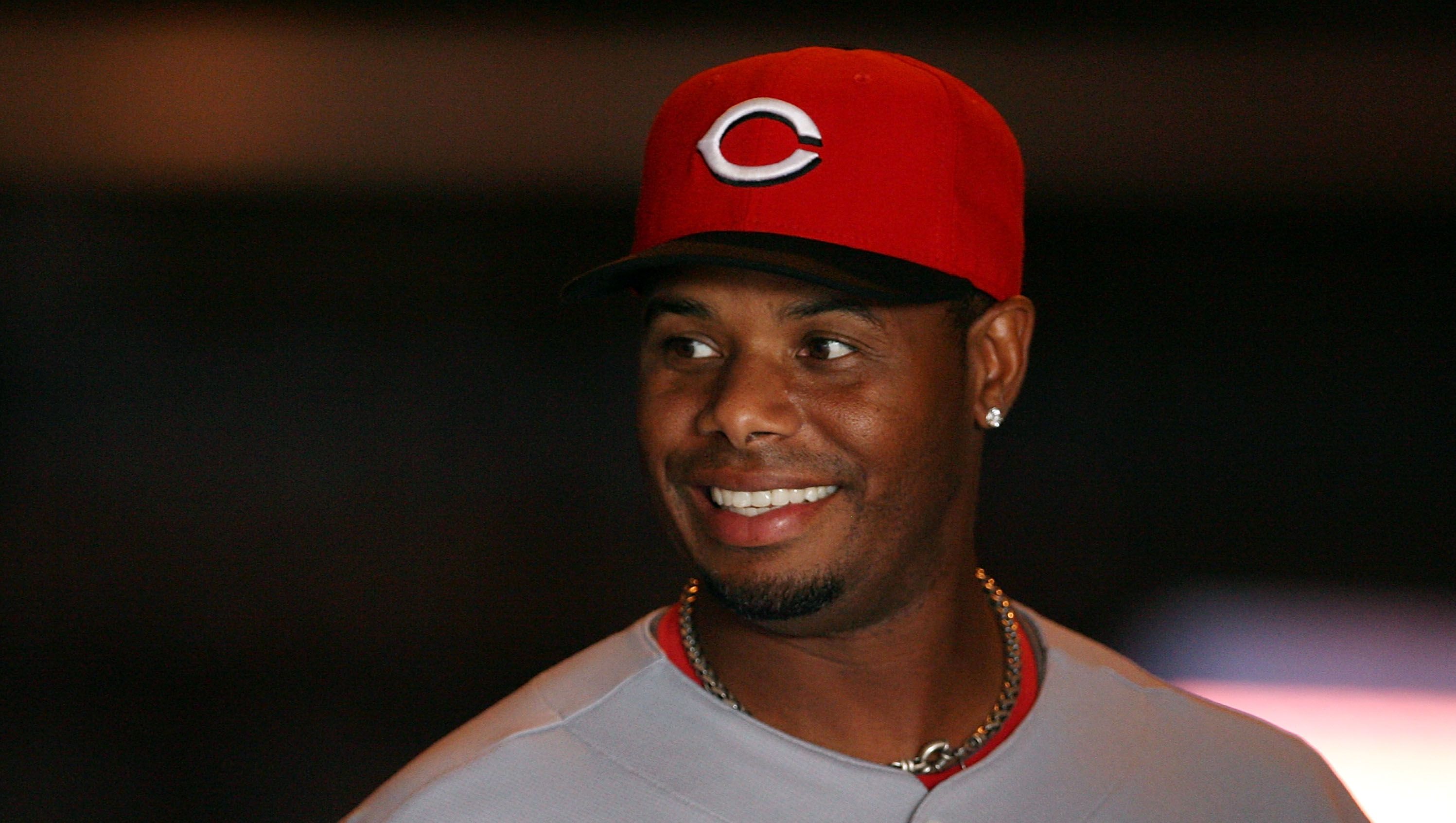 Former MLB player Ken Griffey Jr. looks on from the dugout during a News  Photo - Getty Images