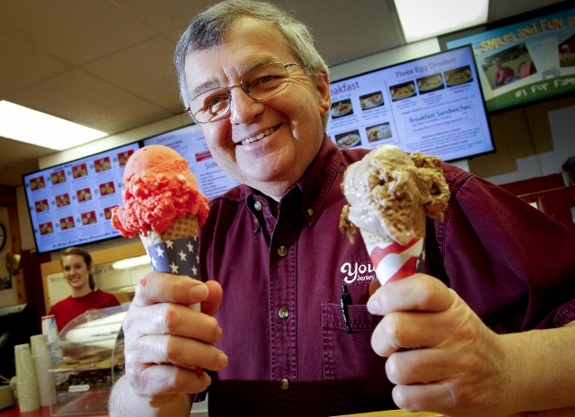 Dan Young, owner of Young’s Dairy, serves up some sorbetto and ice cream in February 2013. File photo by LISA POWELL / STAFF