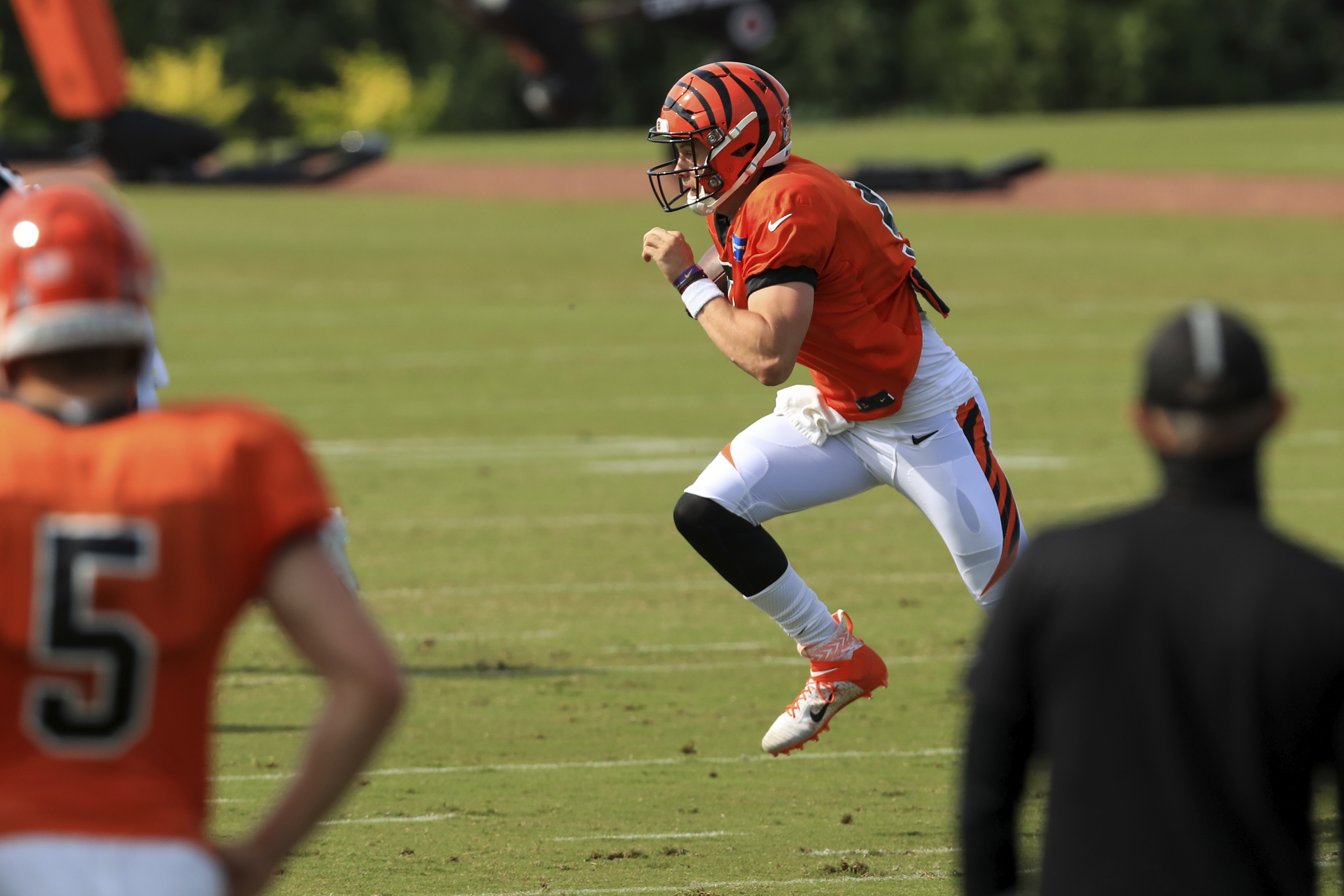 Cincinnati Bengals' Joe Burrow scrambles as he runs a drill during an NFL football camp practice in Cincinnati, Friday, Aug. 21, 2020. (AP Photo/Aaron Doster)