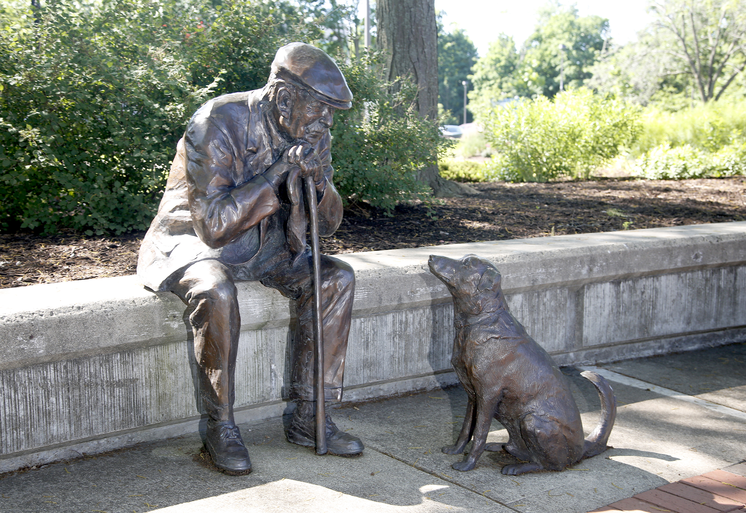 Kettering's Lincoln Park Civic Commons is home to five pieces of public art. Kettering currently has 27 sculptures on display throughout the city. "Old Man and His Dog," is made of bronze and created by Glenna Goodacre. LISA POWELL / STAFF