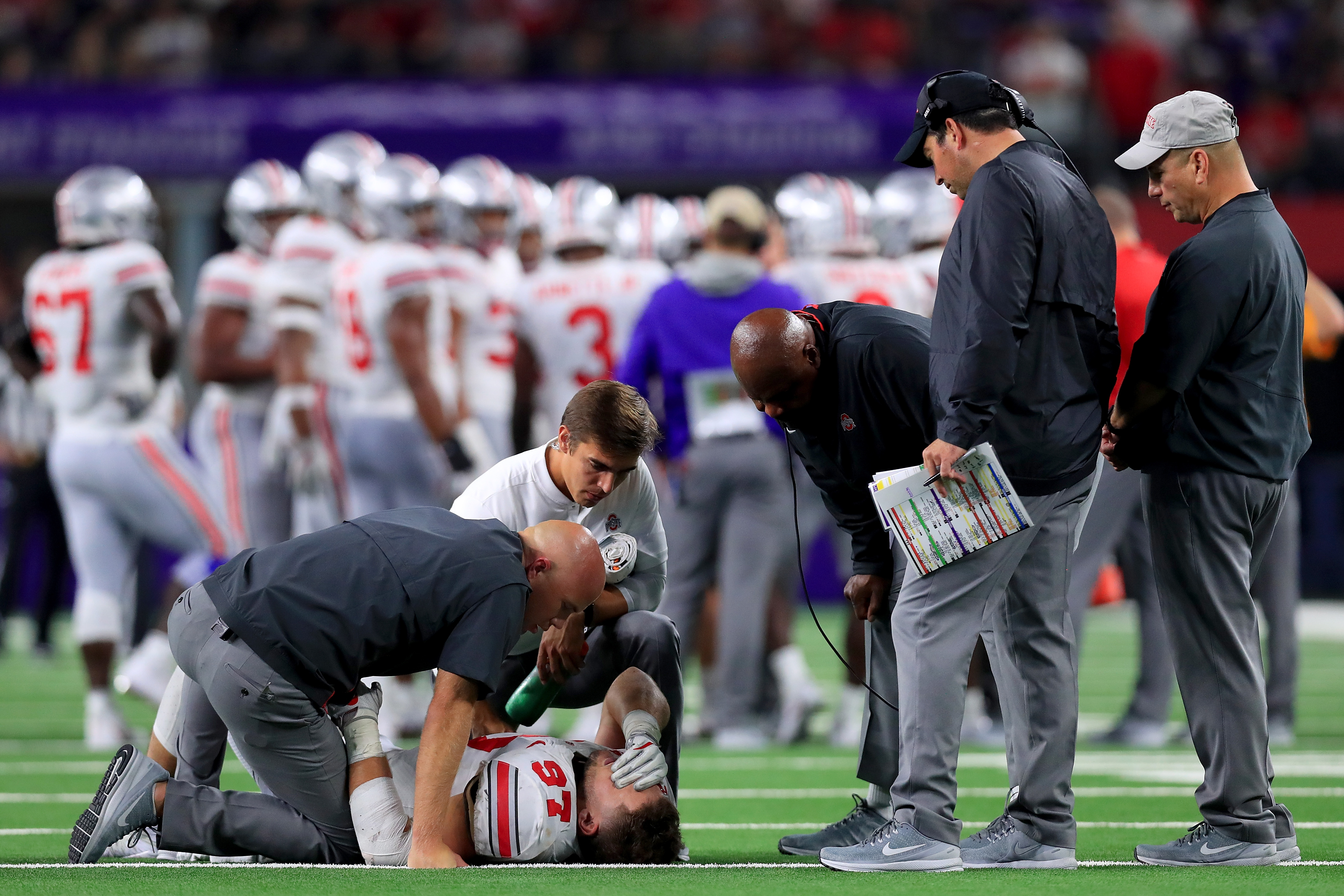 ARLINGTON, TX - SEPTEMBER 15: Nick Bosa #97 of the Ohio State Buckeyes lays on the field after being injured in the third quarter against the TCU Horned Frogs during The AdvoCare Showdown at AT&T Stadium on September 15, 2018 in Arlington, Texas. (Photo by Tom Pennington/Getty Images)