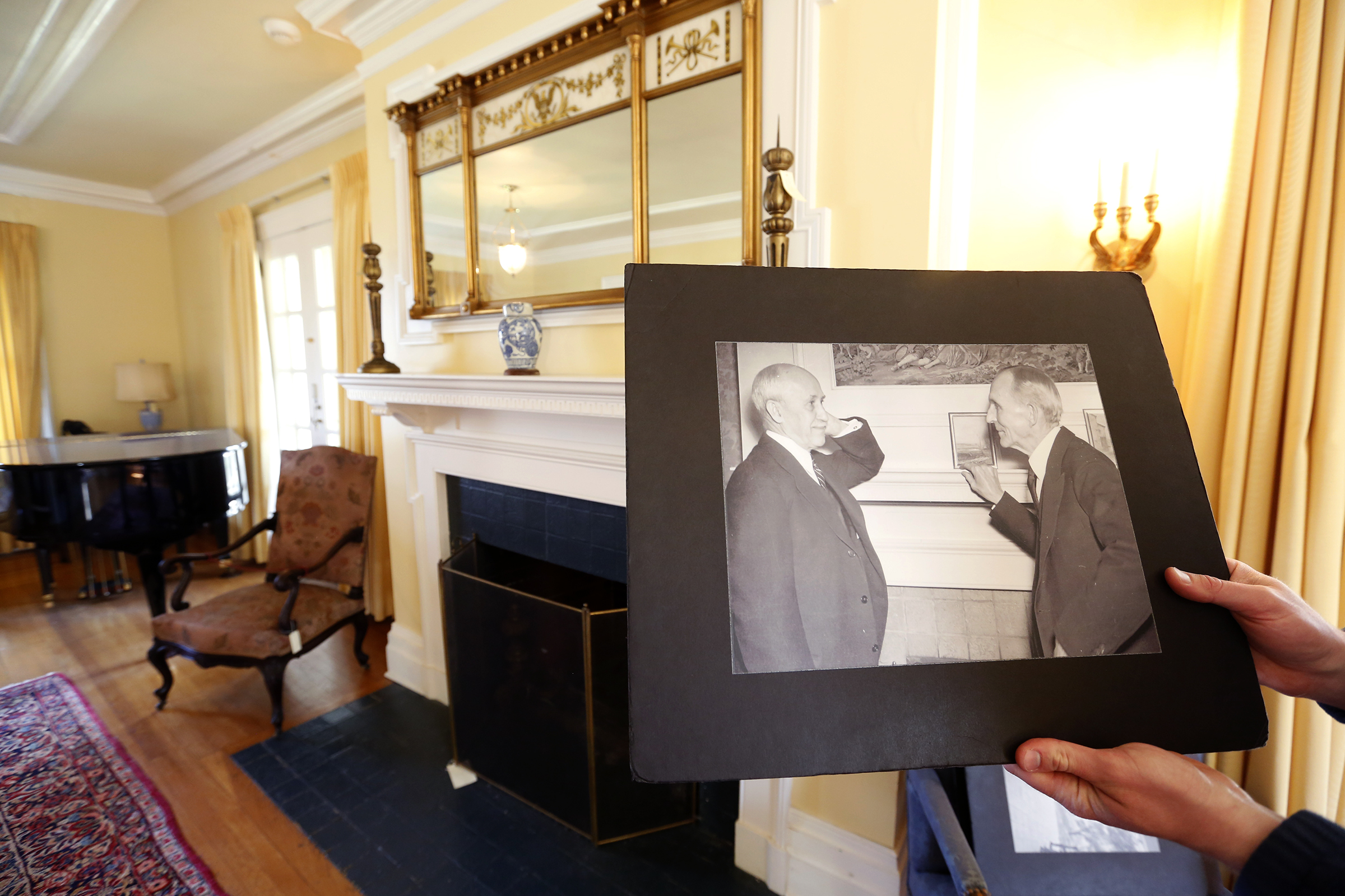 The Wright family home, Hawthorn Hill, was visited by the movers and shakers of the time. Henry Ford, Thomas Edison and Charles Lindbergh were among the famous visitors. The photograph in the foreground is of Henry Ford (right) and Orville Wright standing at the mantel in the background. LISA POWELL / STAFF