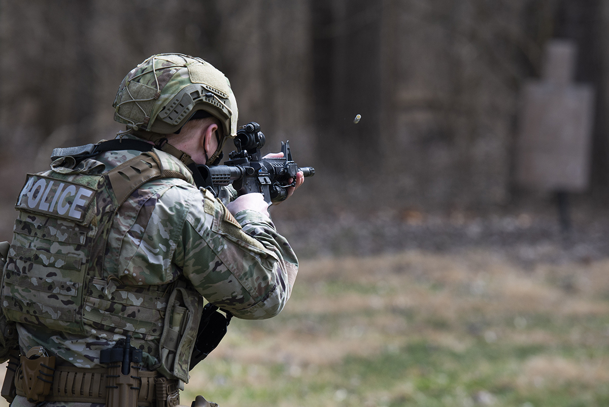 A member of the 88th Security Forces Squadron fires a Simunition round at a fixed target with an M4 carbine rifle during sustainment training at Wright-Patterson Air Force Base on March 17. U.S. AIR FORCE PHOTO/WESLEY FARNSWORTH