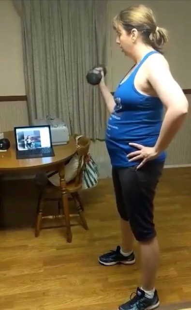 Kettering Zumba instructor Yvette "Diva" Williams teaches her classes ever evening on Facebook Live. Pictured: Student Colleen Green takes the class in the Dayton area.
