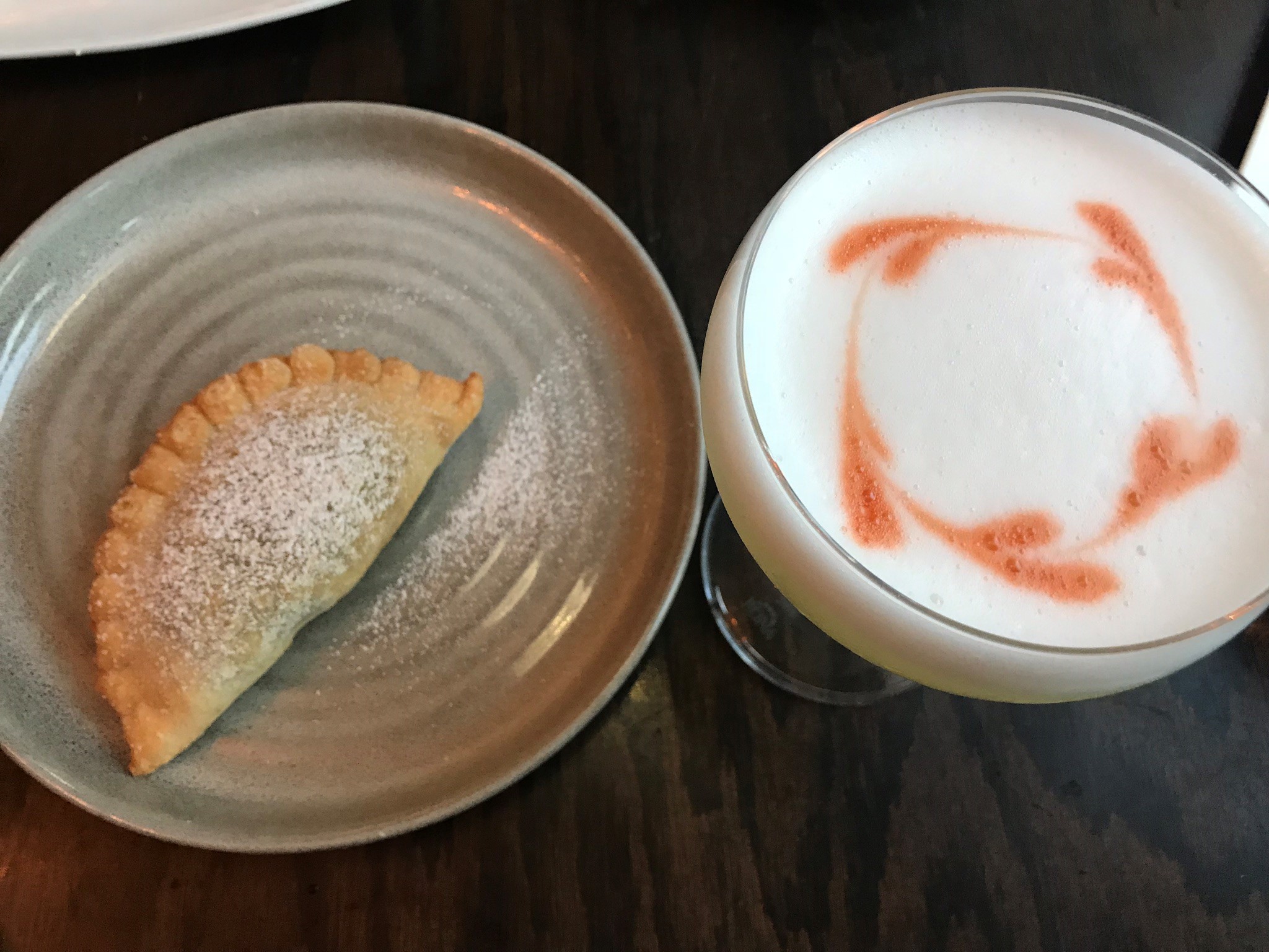 An empanada and pisco sour at Salar in the Oregon District.