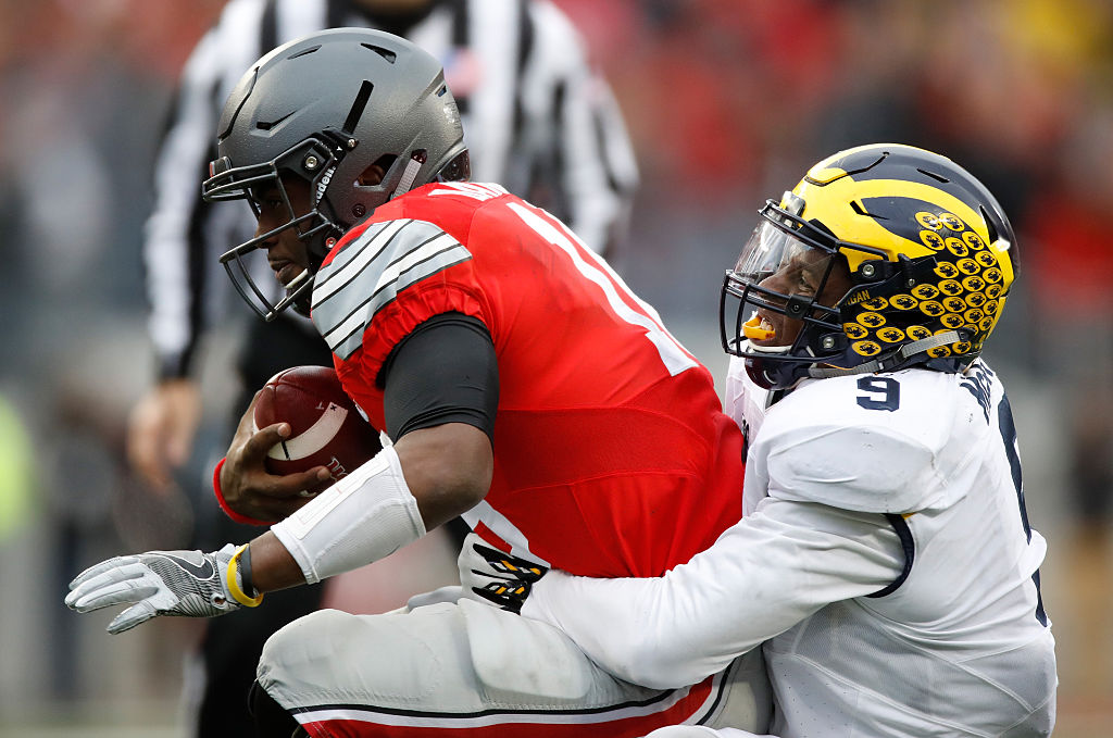 COLUMBUS, OH - NOVEMBER 26: Mike McCray #9 of the Michigan Wolverines sacks J.T. Barrett #16 of the Ohio State Buckeyes during the second half of their game at Ohio Stadium on November 26, 2016 in Columbus, Ohio. (Photo by Gregory Shamus/Getty Images)