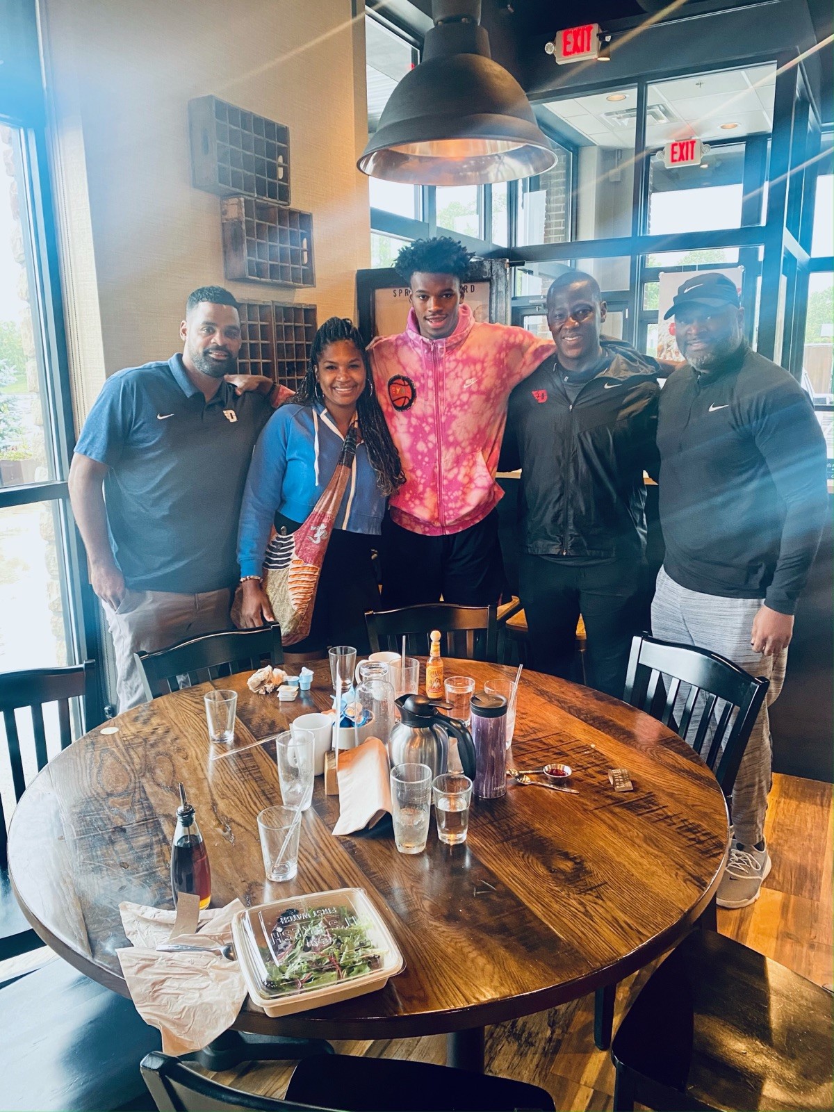 From left: UD assistant coach Ricardo Greer, Tomika Holmes, DaRon II, UD head coach Anthony Grant and DaRon Holmes Sr. CONTRIBUTED