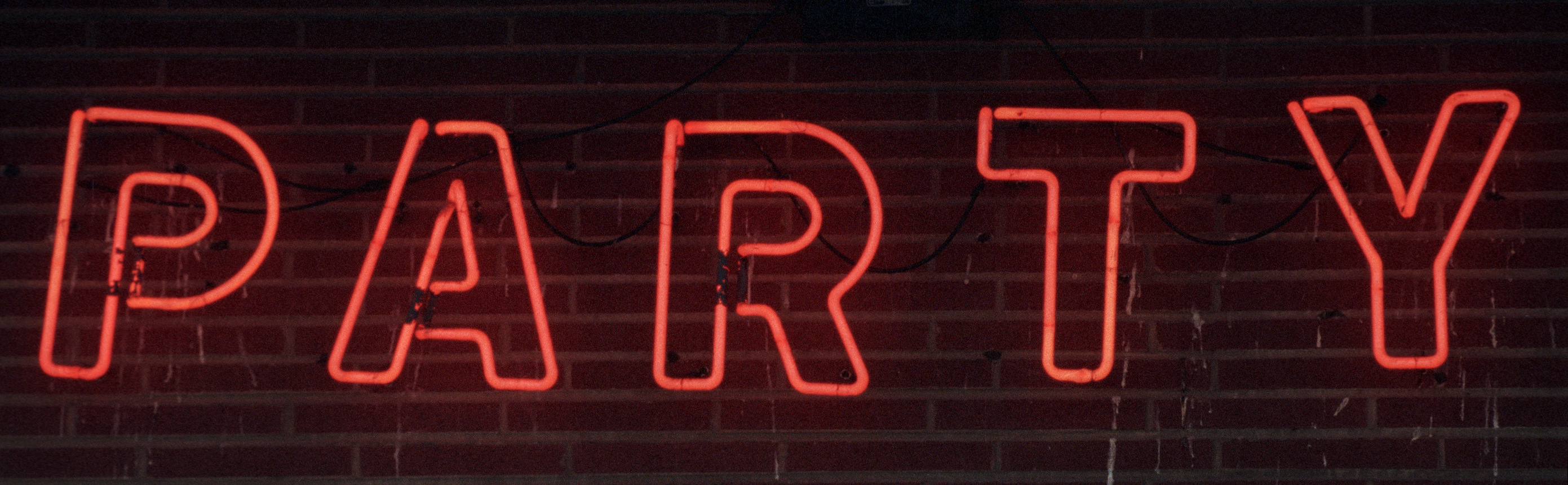 Neon Party Depot sign on South Broadway in Fairborn. TY GREENLEES / STAFF