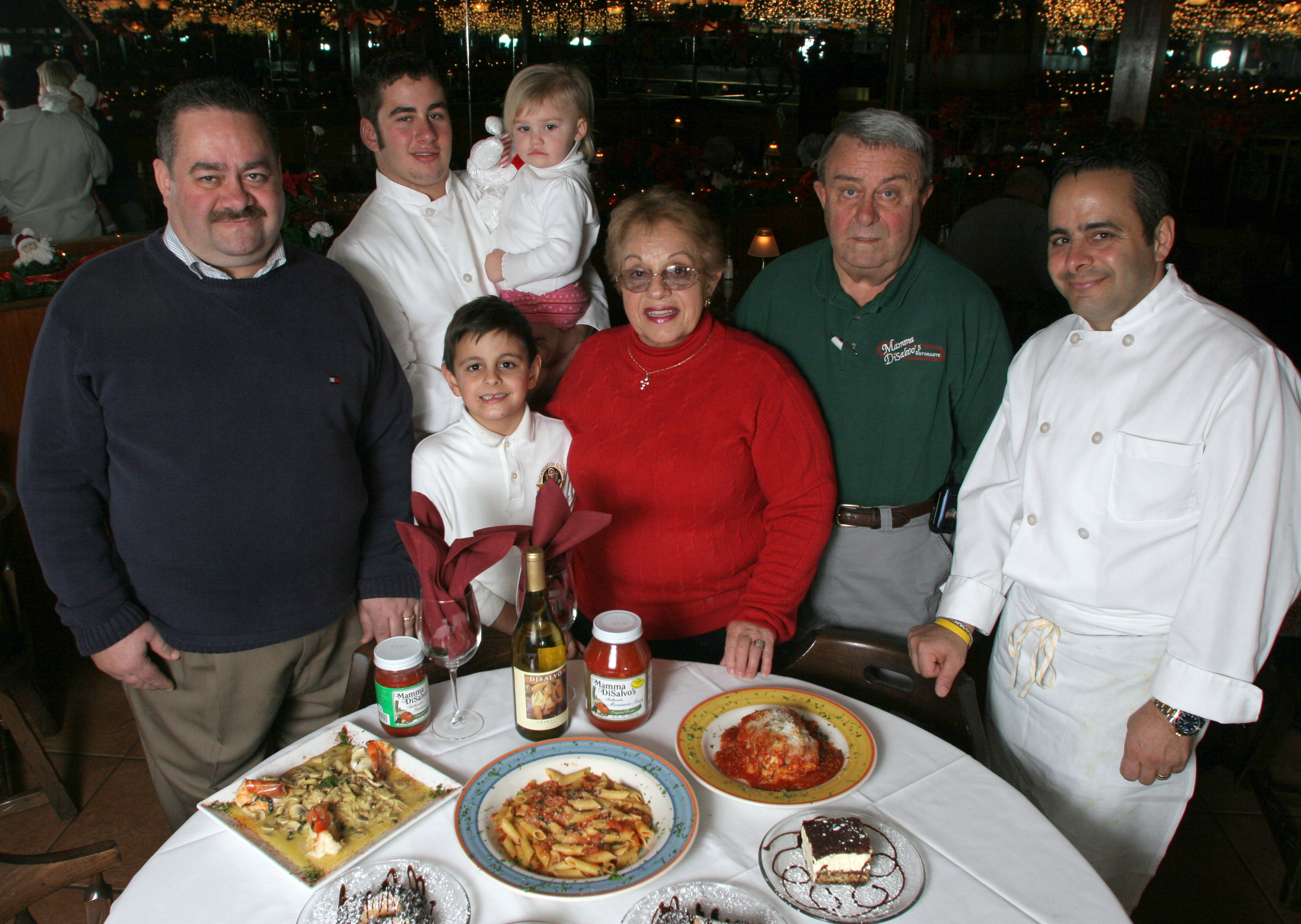 The DiSalvo family pictured in 2005: (from left) Nick, Andrew holding Abigail, 1, Vincenzo, 7, Elena "Mamma", "Papa" Rinaldo Sr. and Roberto are among the family members who run the Kettering establishment. PHOTO BY JAN UNDERWOOD