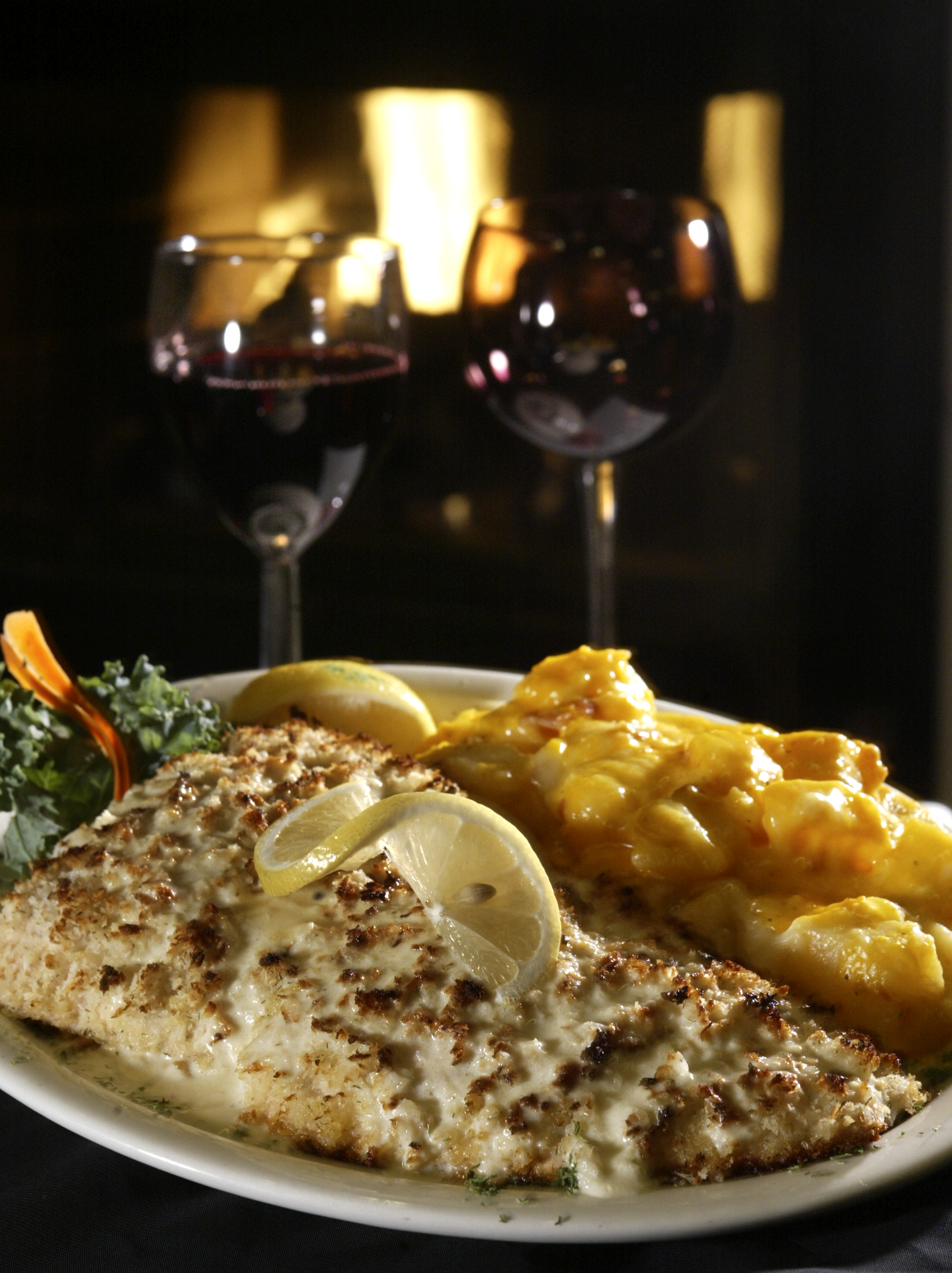 Horseradish encrusted salmon and au gratin potatoes at The Barnsider restaurant in Dayton. STAFF FILE PHOTO BY LISA POWELL