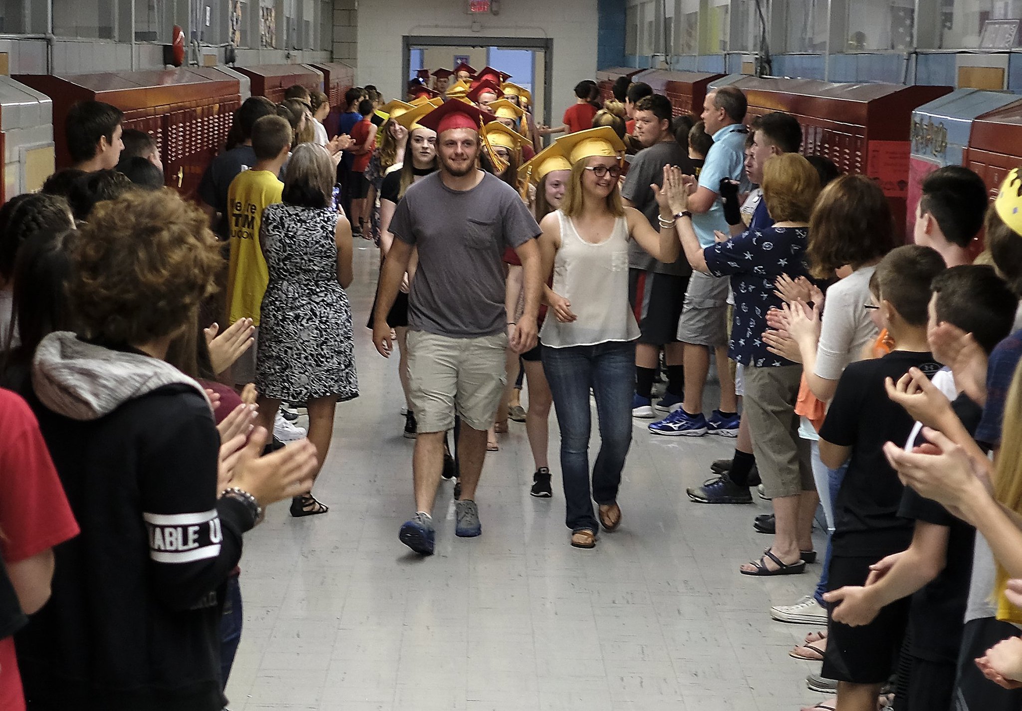 The graduating seniors from Northeastern High School got a chance to see where it all began for most of them 12 years ago as they marched through South Vienna School Friday with their graduation caps on. Bill Lackey/Staff