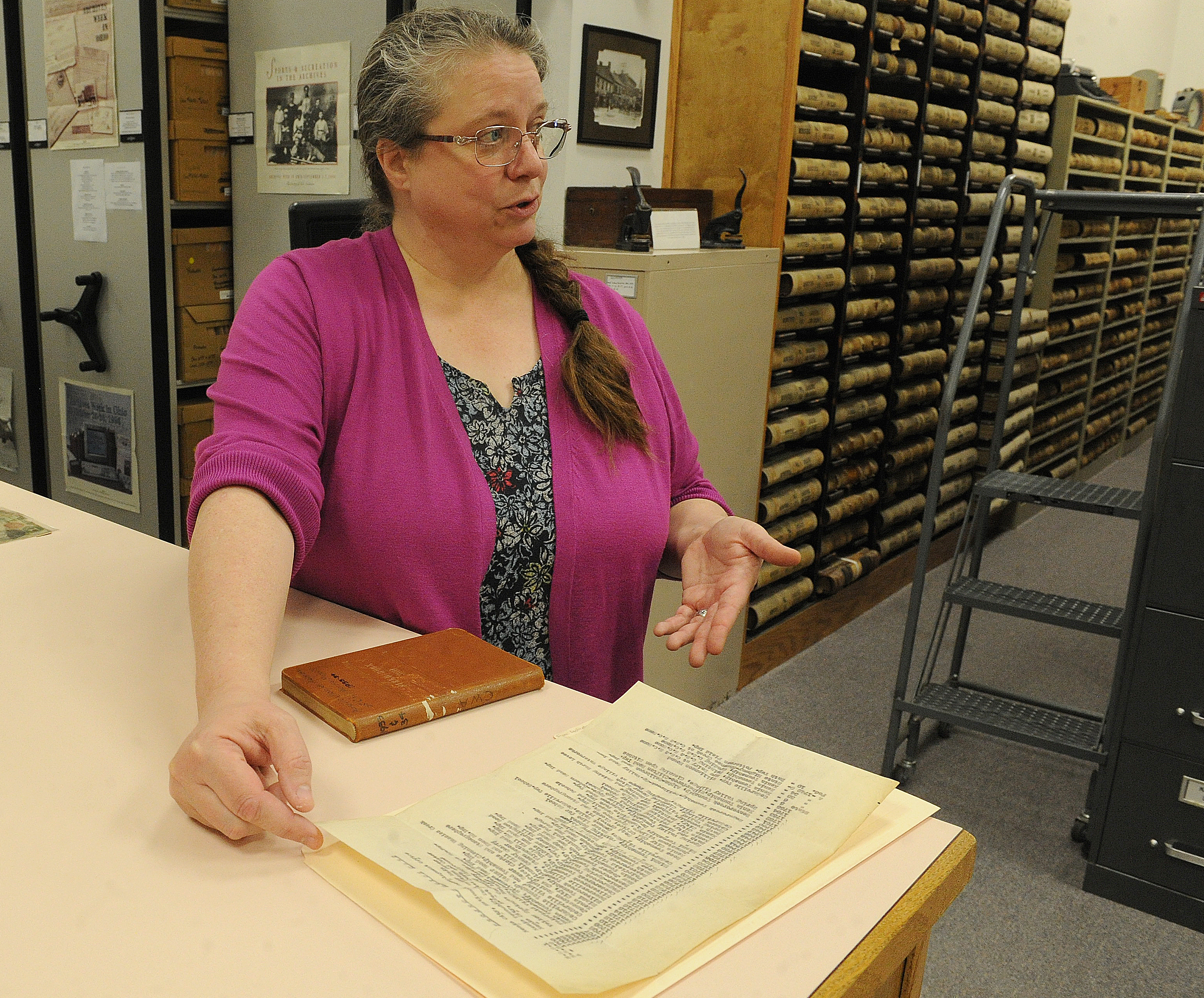 Records Manager Robin Heise points out some of the interesting finds in the Greene County Archives. MARSHALL GORBY\STAFF