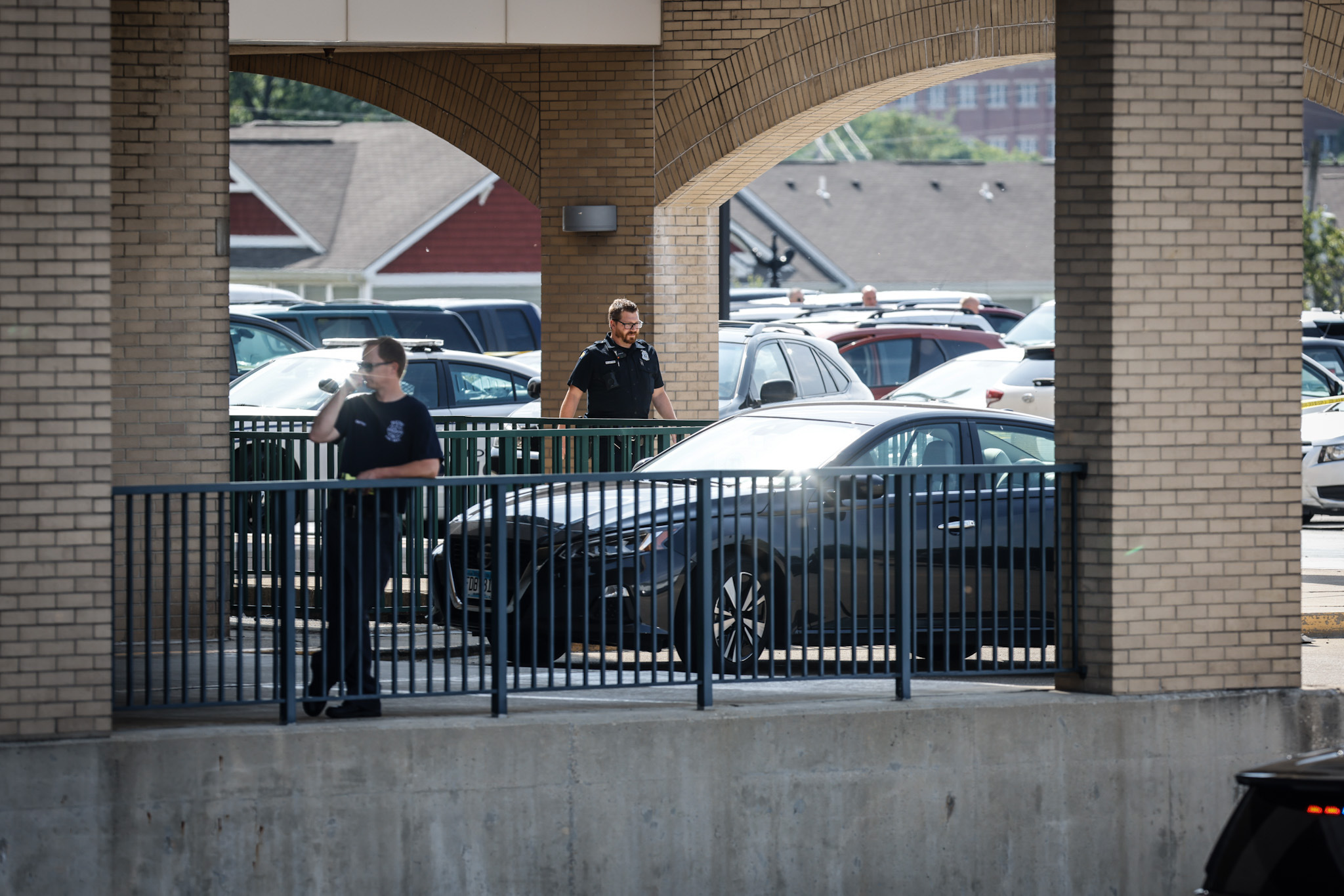 Police are shown at the emergency room entrance of Miami Valley Hospital on Wednesday, June 1, 2022. A Montgomery County Jail inmate shot and killed a private security guard and then himself in a shooting at the hospital.  JIM NOELKER/STAFF