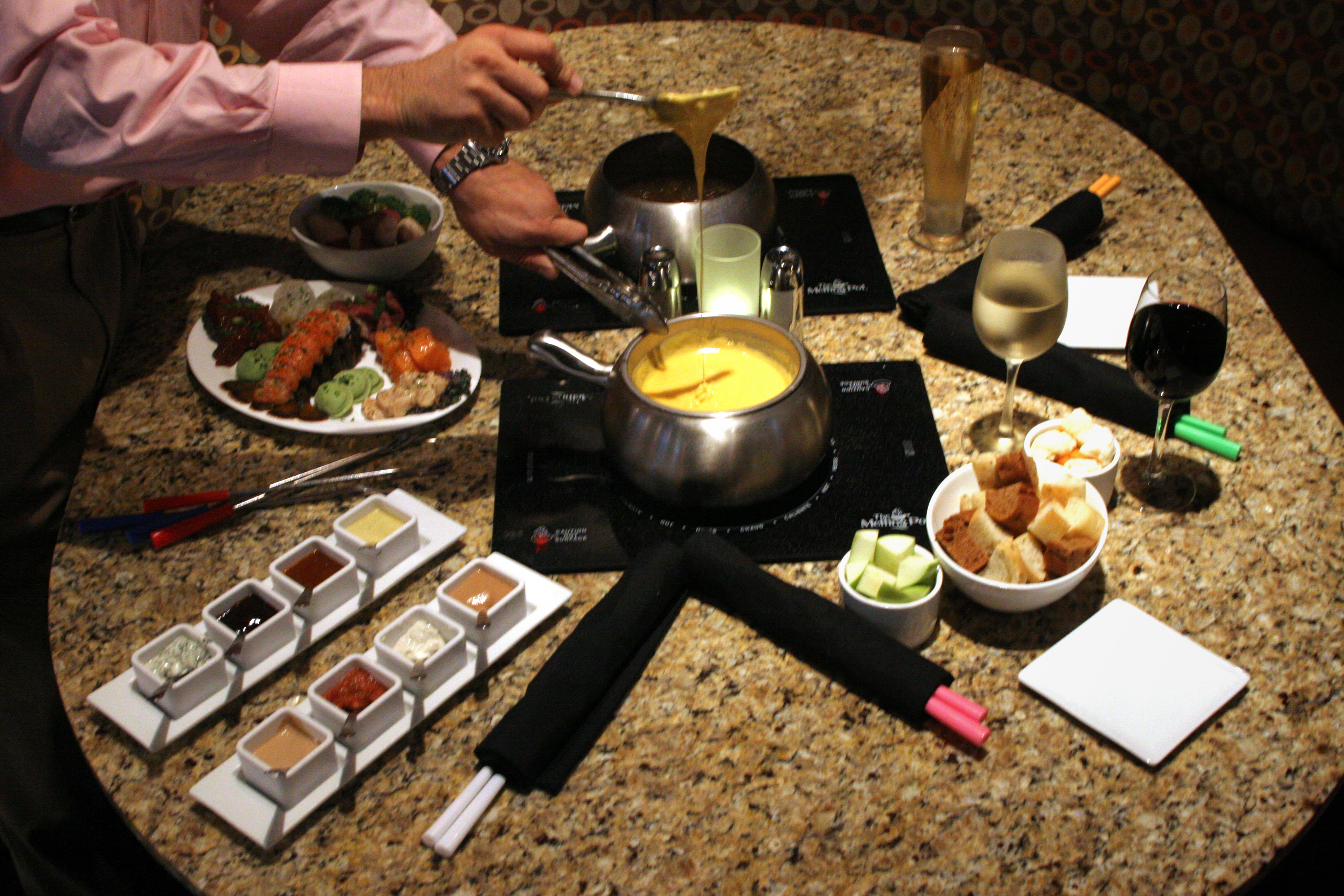 The menu item Fondue Fusion at the Melting Pot in Centerville includes lobster tail, filet mignon, cedar plank salmon, BBQ pork tenderloin, shrimp, honey dijon chicken and spinach/artichoke ravioli with dipping sauce and fondue.