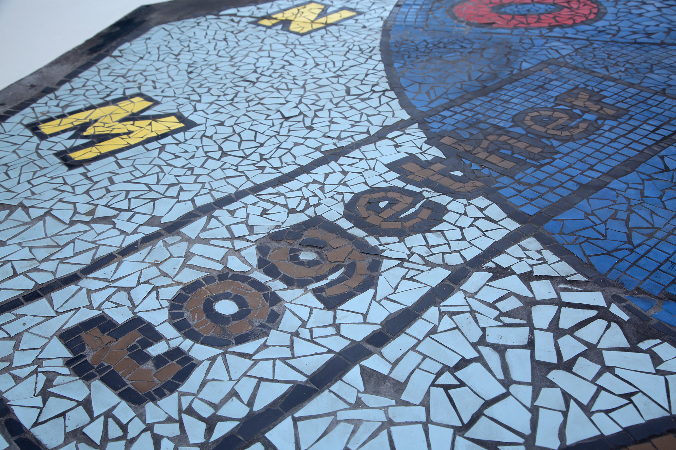 "Together We Rise," is a new large-scale play area and work of art in West Dayton. The in-ground mosaic is a play station designed with interactive games, alphabet letters and raised areas for crayon rubbings. It is located in a playground at the intersection of Harvard Boulevard and Burroughs Drive on the Omega CDC Harvard Campus. LISA POWELL / STAFF