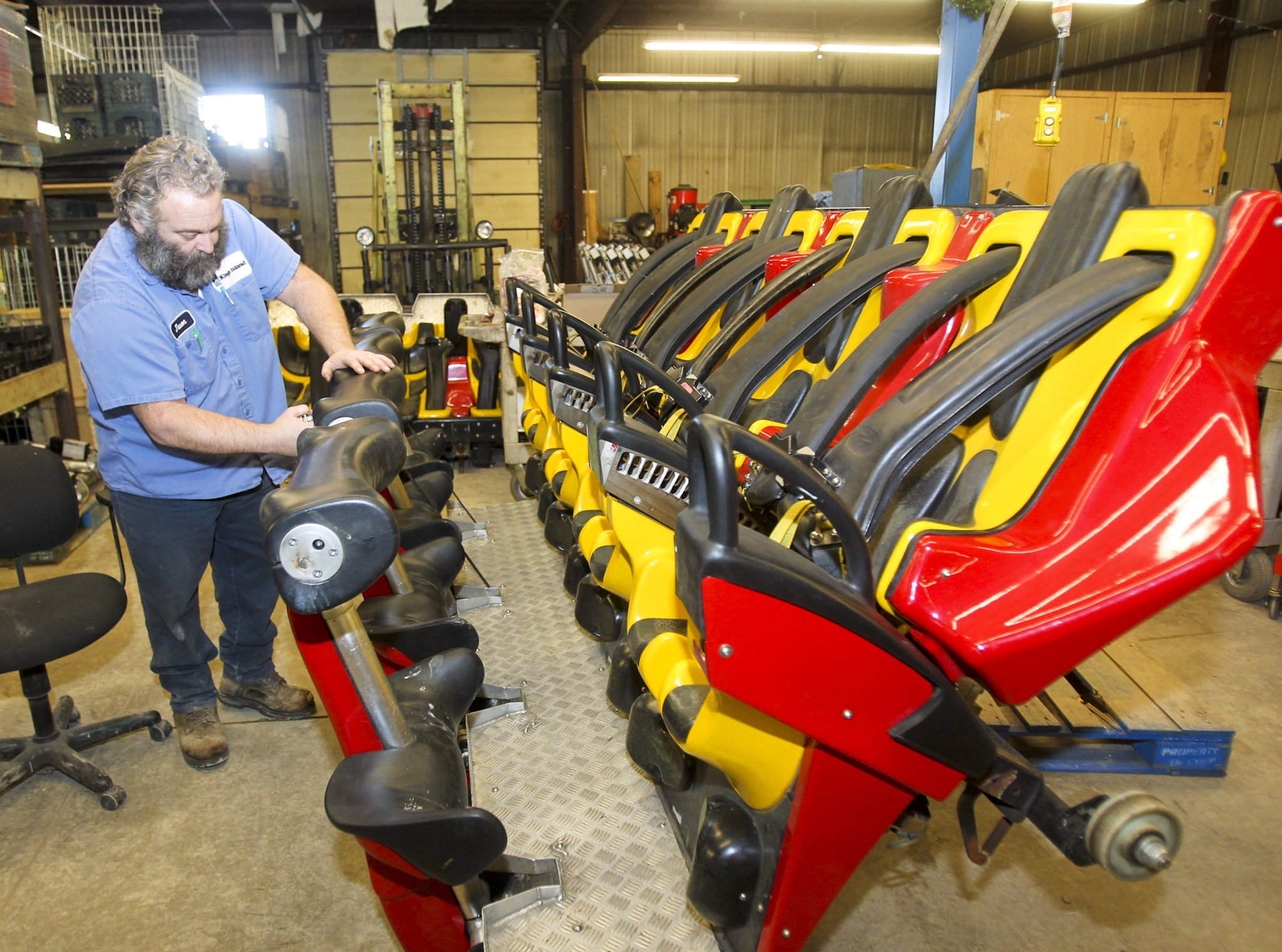 A Kings Island maintenance worker works on the Firehawk ride in 2014.
