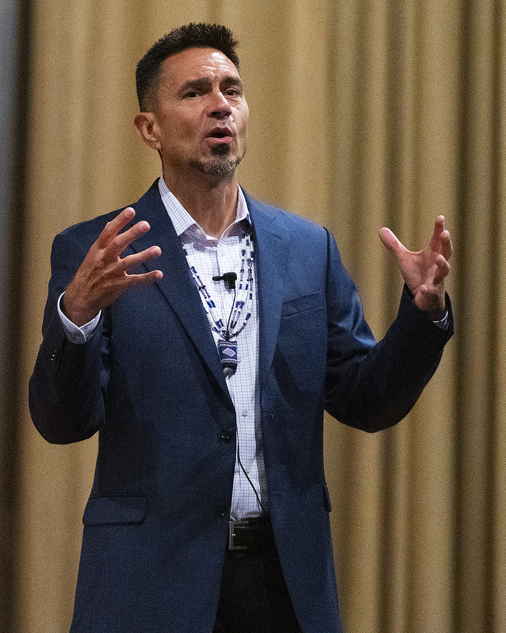 D.J. Vanas talks to Airmen about having the warrior spirit during his presentation June 24 at the Wright-Patterson Air Force Base Theater. The Ottawa Tribe member and former Air Force officer says tribal principles that led the first cultures in America can be applied today to lead organizations. U.S. AIR FORCE PHOTO/R.J.ORIEZ