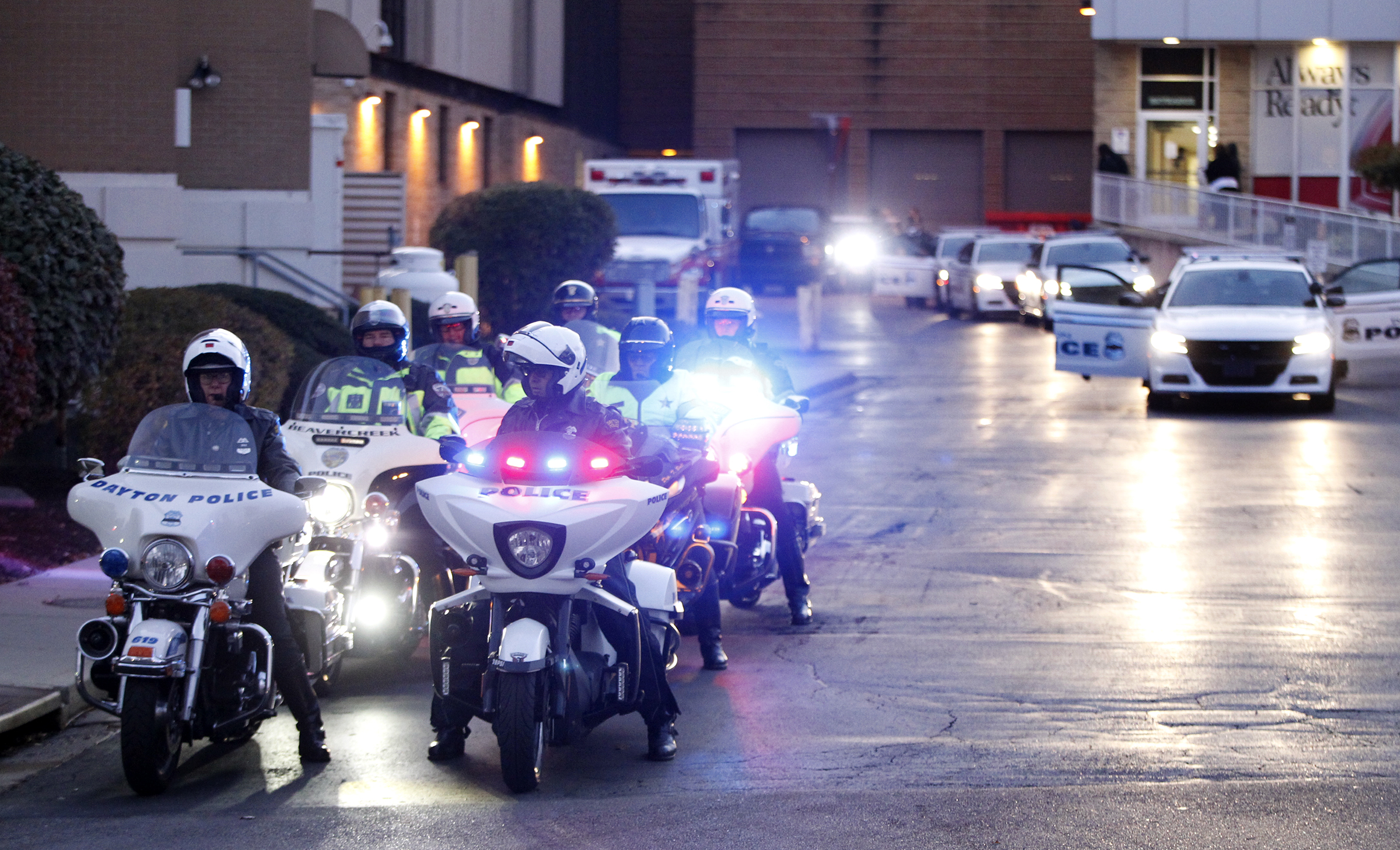 The body of Det. Jorge Del Rio was escorted from Grandview Hospital by a procession of police vehicles to the Montgomery County Coroner's Office Thursday evening. Del Rio was shot twice and critically injured Monday evening while serving a drug-related warrant as part of a DEA task force. LISA POWELL / STAFF