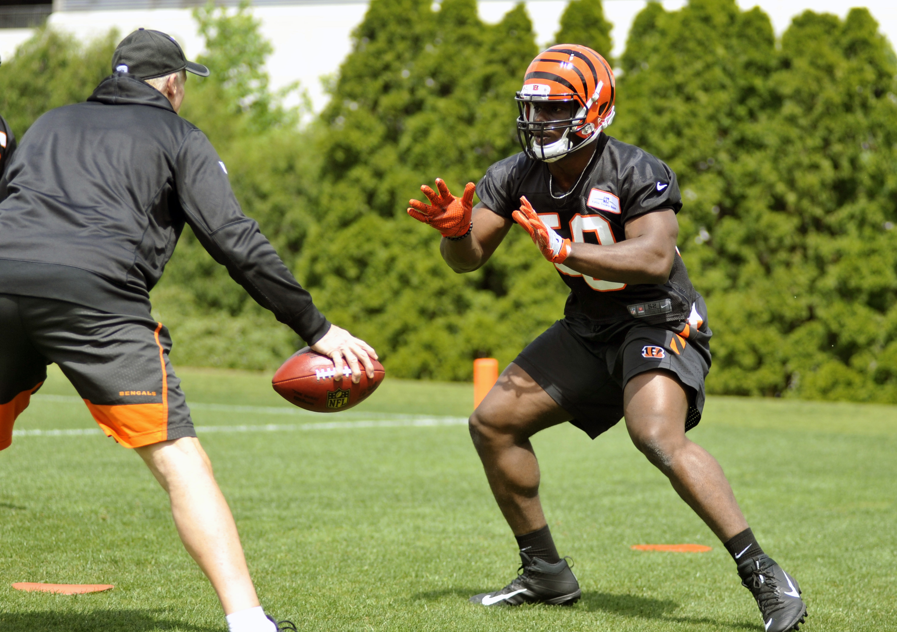 Cincinnati Bengals fourth-round pick Carl Lawson works during rookie camp at Paul Brown Stadium. Jay Morrison/Staff