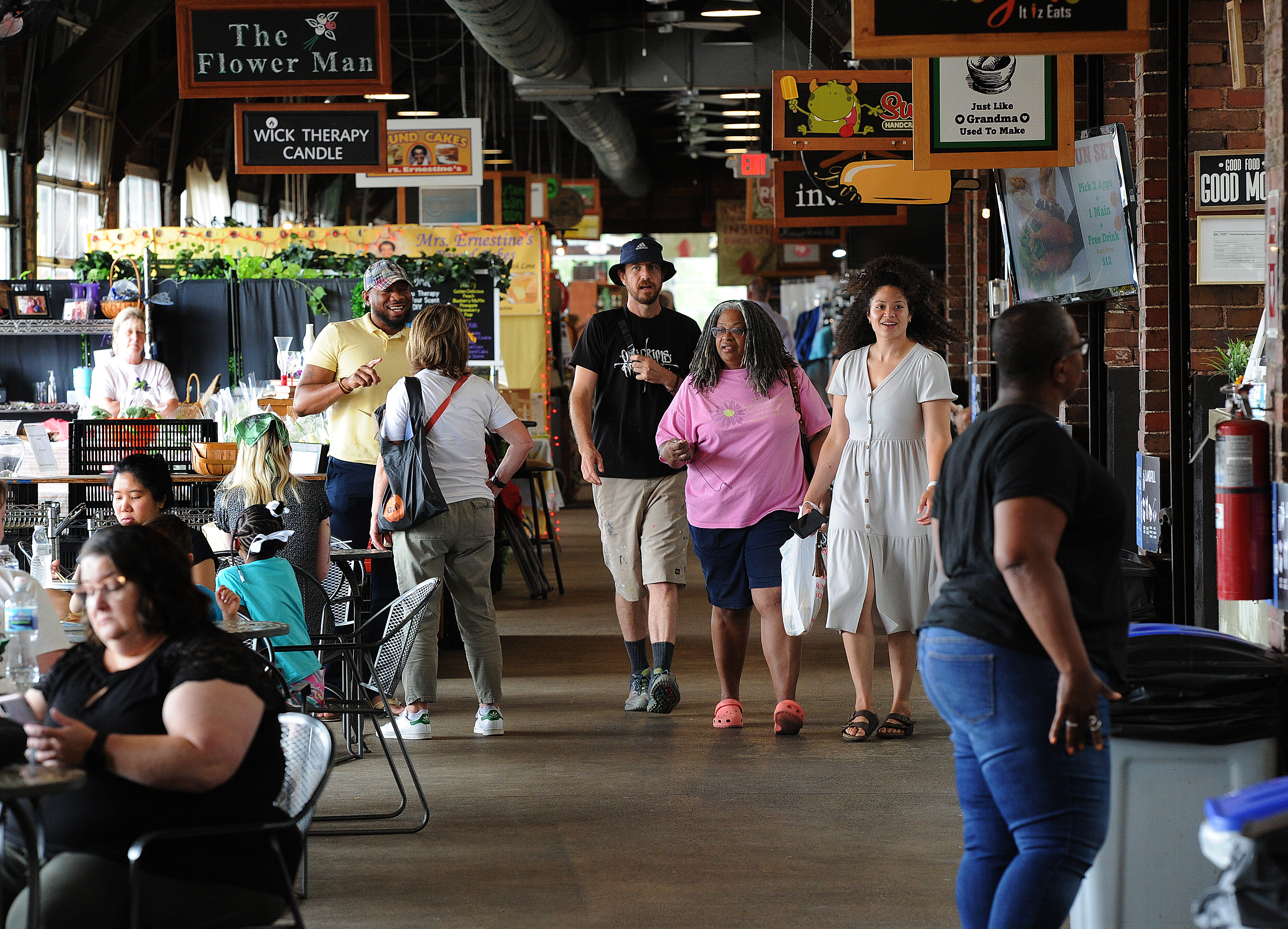 People still enjoy shopping at Second Street Market even with the higher prices for services and products in the Dayton area.  Marshall Gorby / Crew