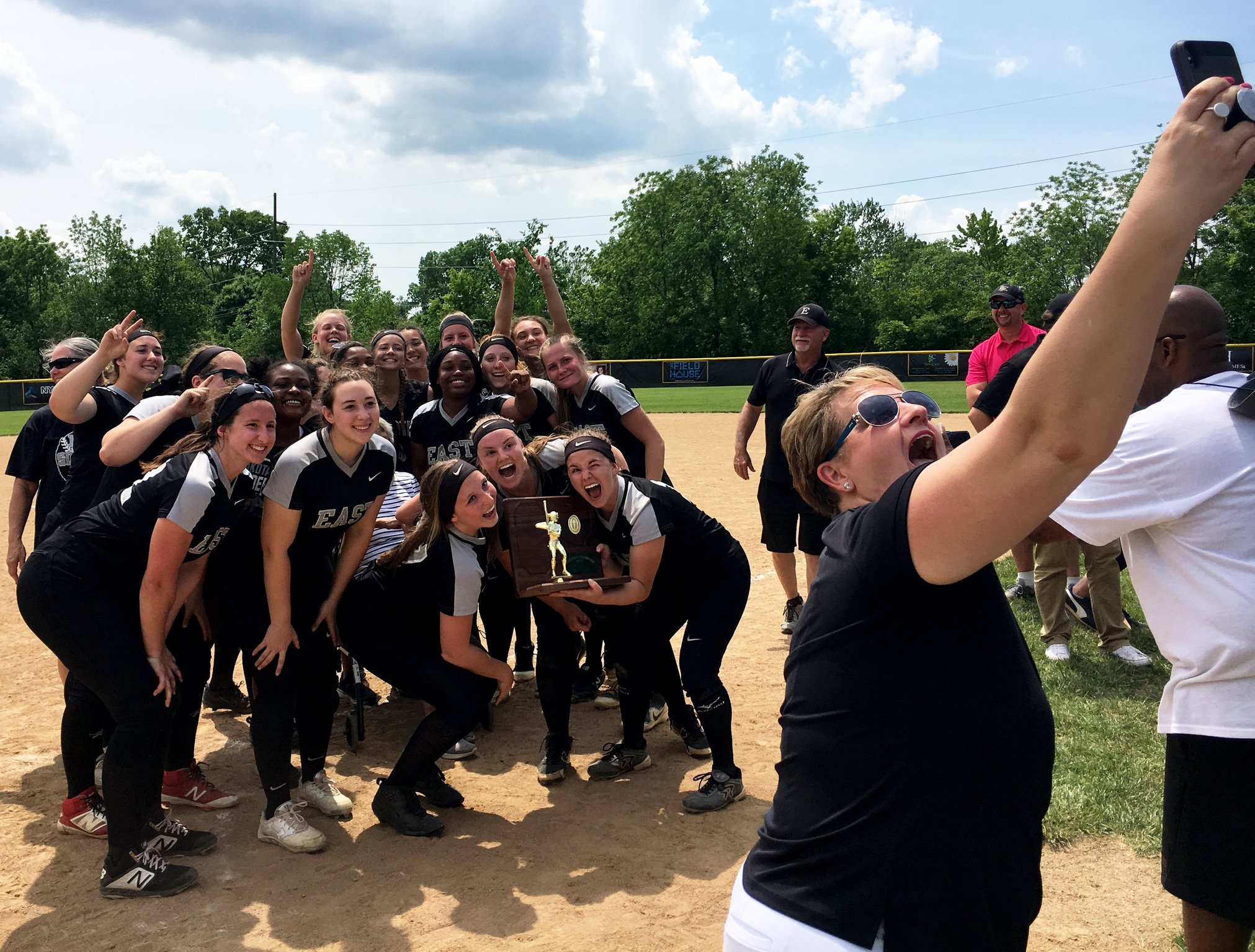 It’s selfie time for Lakota East’s softball team Saturday after the Thunderhawks captured a Division I regional championship with a 2-1 win over Lakota West at Centerville. RICK CASSANO/STAFF