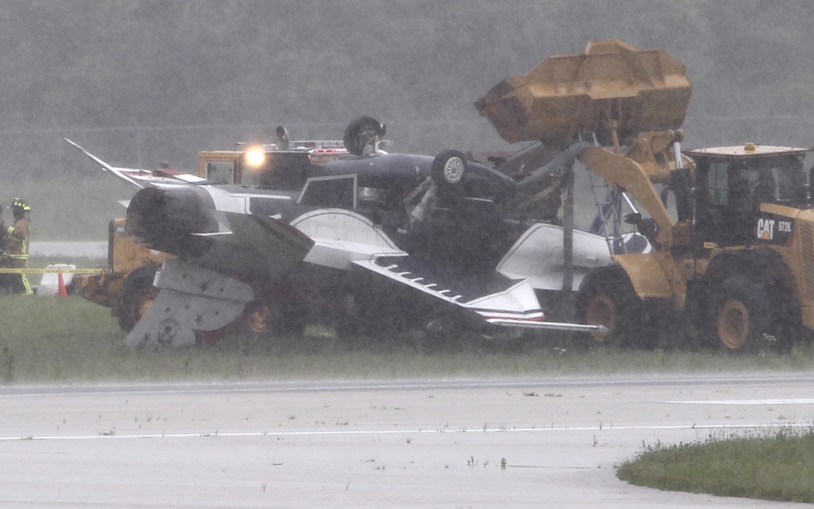 Thunderbird jet flipped over after taxiing at Dayton international airport on Friday, June 23. TY GREENLEES / STAFF