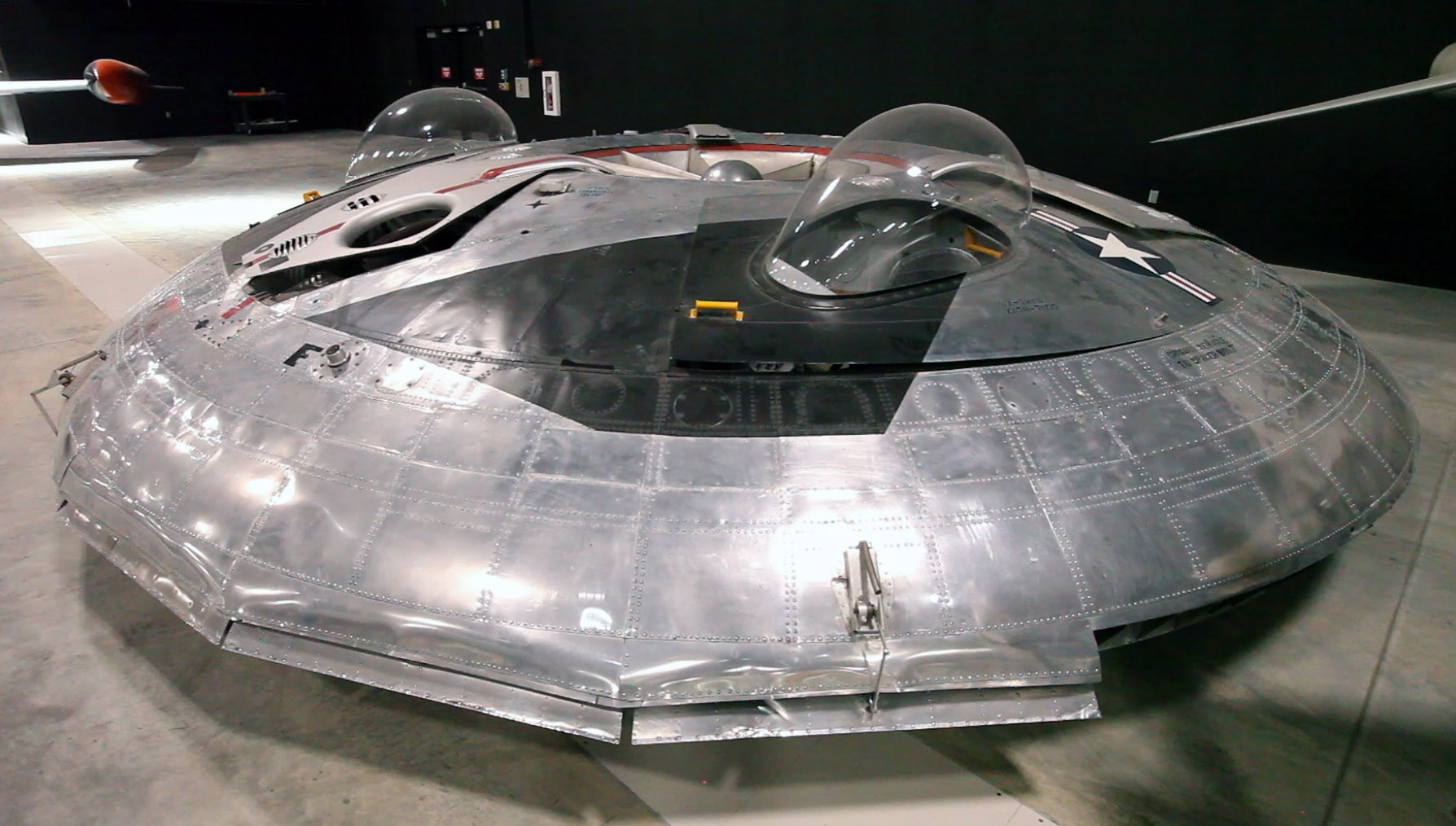 The Avro Canada VZ-9AV Avrocar is as close to a flying saucer that any aircraft gets in the National Museum of the U.S. Air Force fourth building. The circular flying wing was built with three turbine engines exhaust driving a central circular turborotor. The Avrocar did fly, but became almost uncontrollable when it left the cushioning ground effect air just a few feet high.