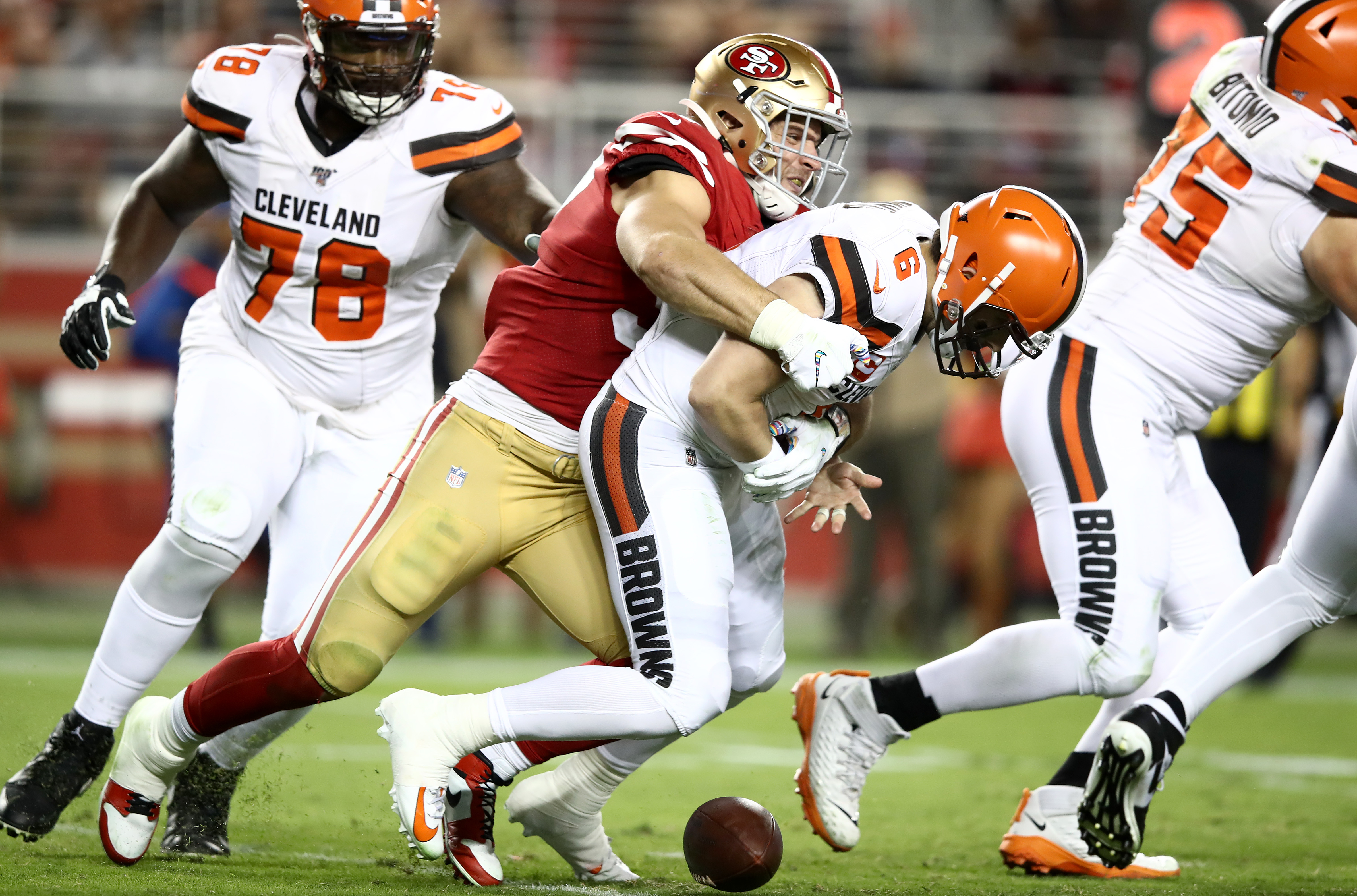 The Cleveland Browns celebrate a sack against the Cincinnati