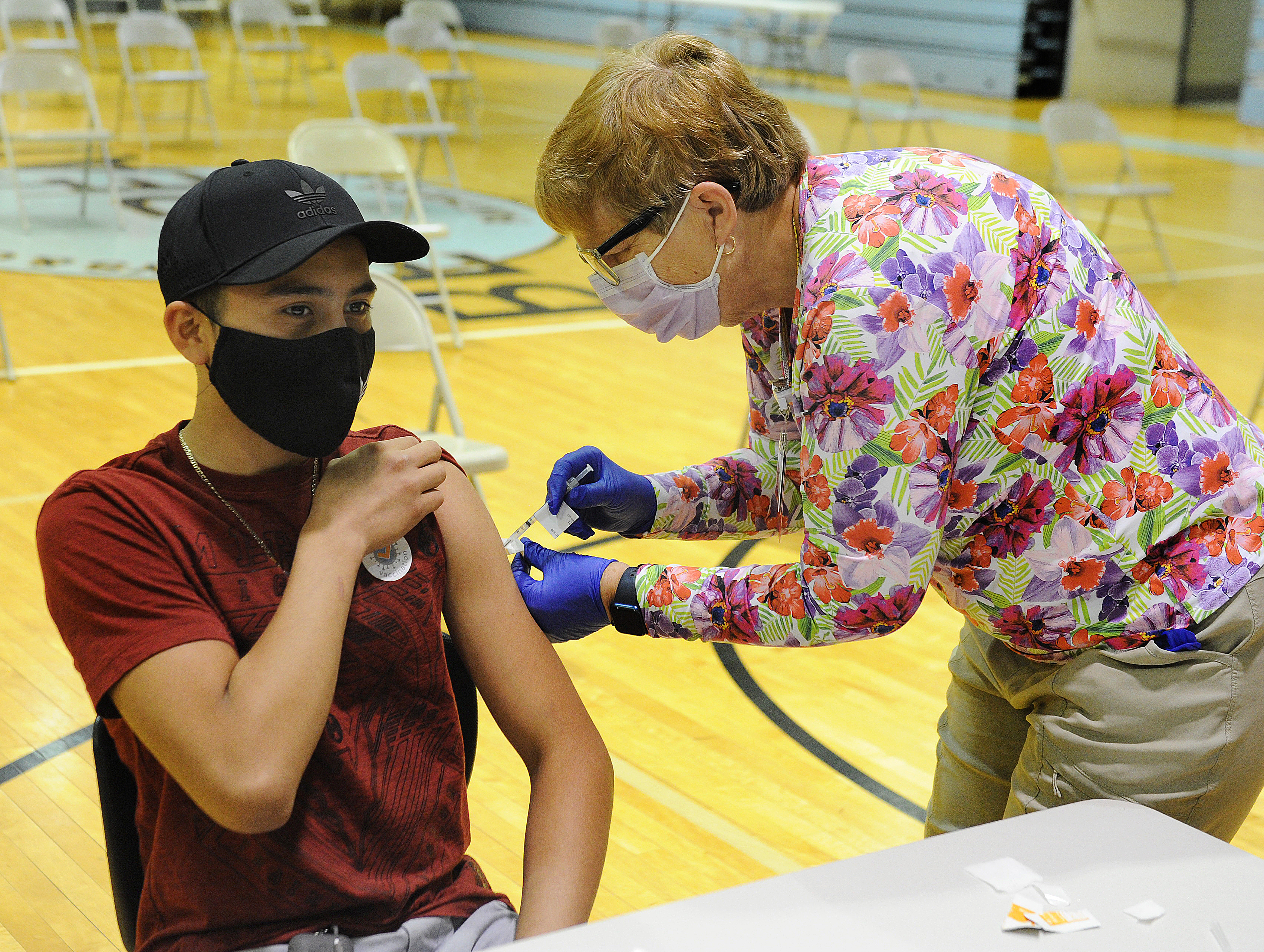 Julio Arquelles, age 13, receives his COVID-19 vaccine Friday June 4, 2021. Dayton Children’s partners with Boys & Girls Club of Dayton to offer COVID-19 vaccine clinic for individuals 12 years and older. MARSHALL GORBY\STAFF