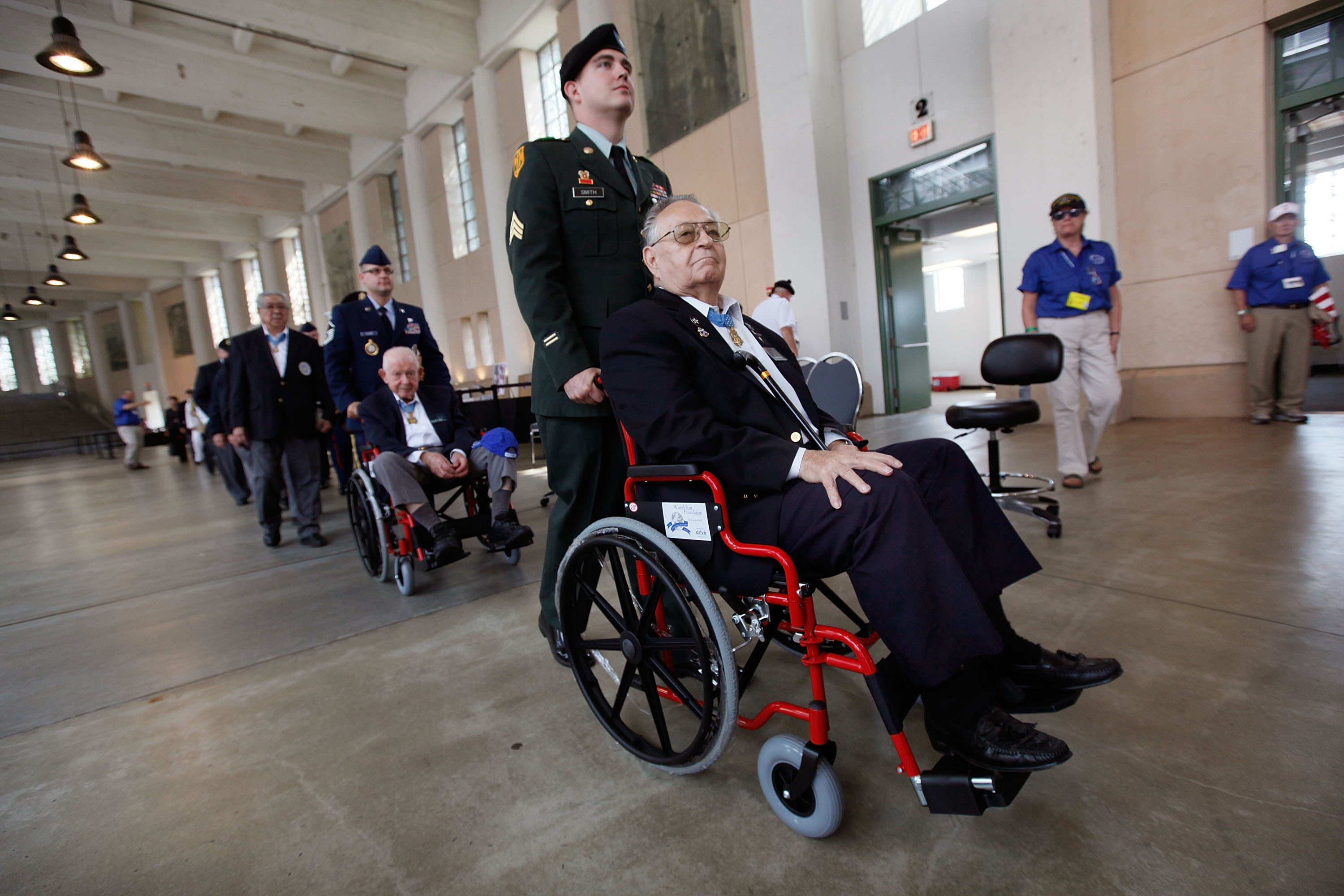 CHICAGO - SEPTEMBER 15: Congressional Medal of Honor recipients Ronald Rosser (R) and Bernard Fisher (L) are pushed out for the start of the opening ceremony for the Medal of Honor Society Convention at Soldier Field September 15, 2009 in Chicago, Illinois. The Medal of Honor is the highest military honor awarded for bravery on the battlefield. There are currently 95 living Medal of Honor Recipients. (Photo by Scott Olson/Getty Images)