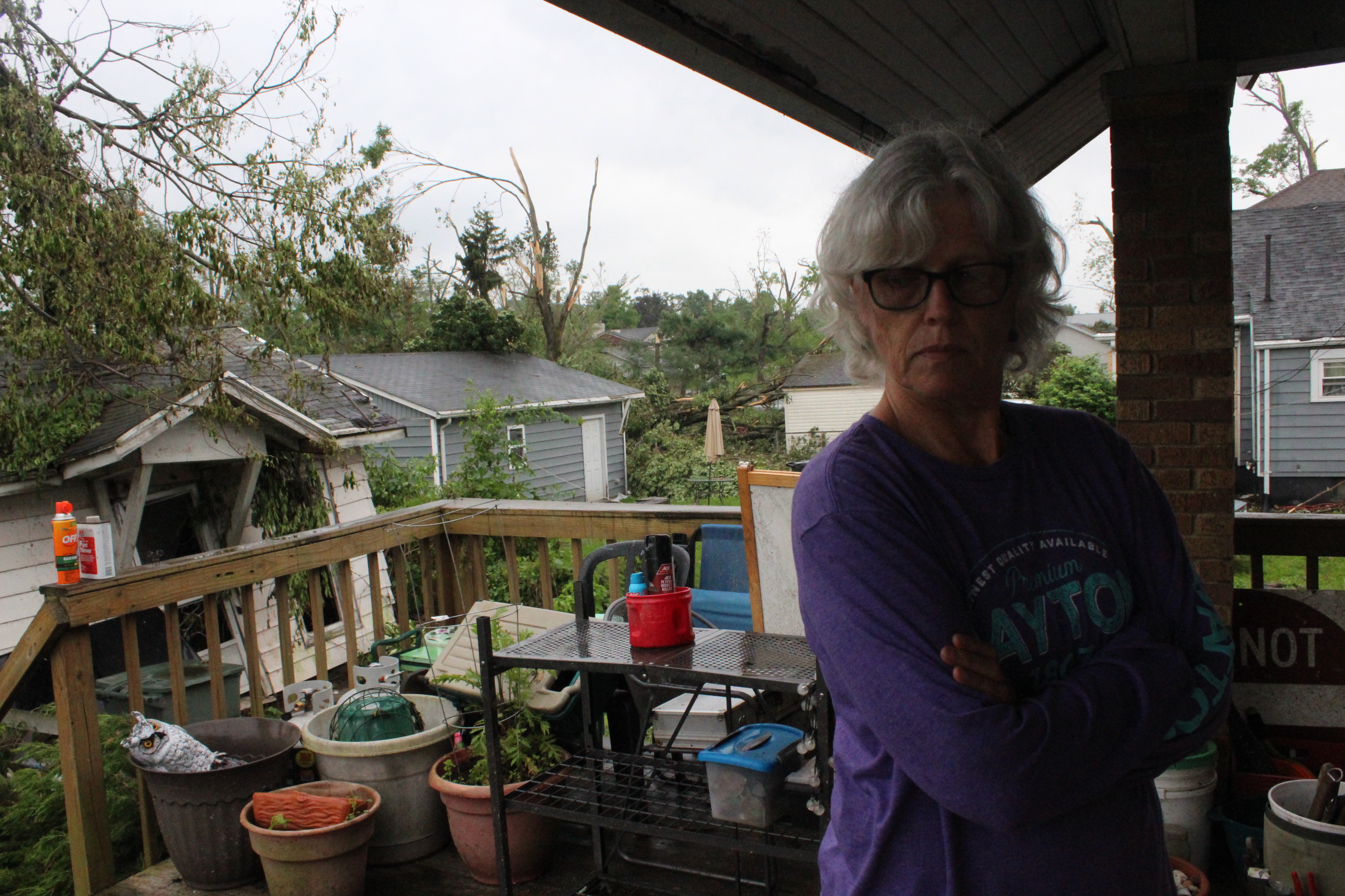 Robin Sassenberg of Dayton. Friends and volunteers from Oregon District business helped the couple remove debris and secure their Hilldale Avenue home in the wake of the Memorial Day tornadoes. Photos by Amelia Robinson