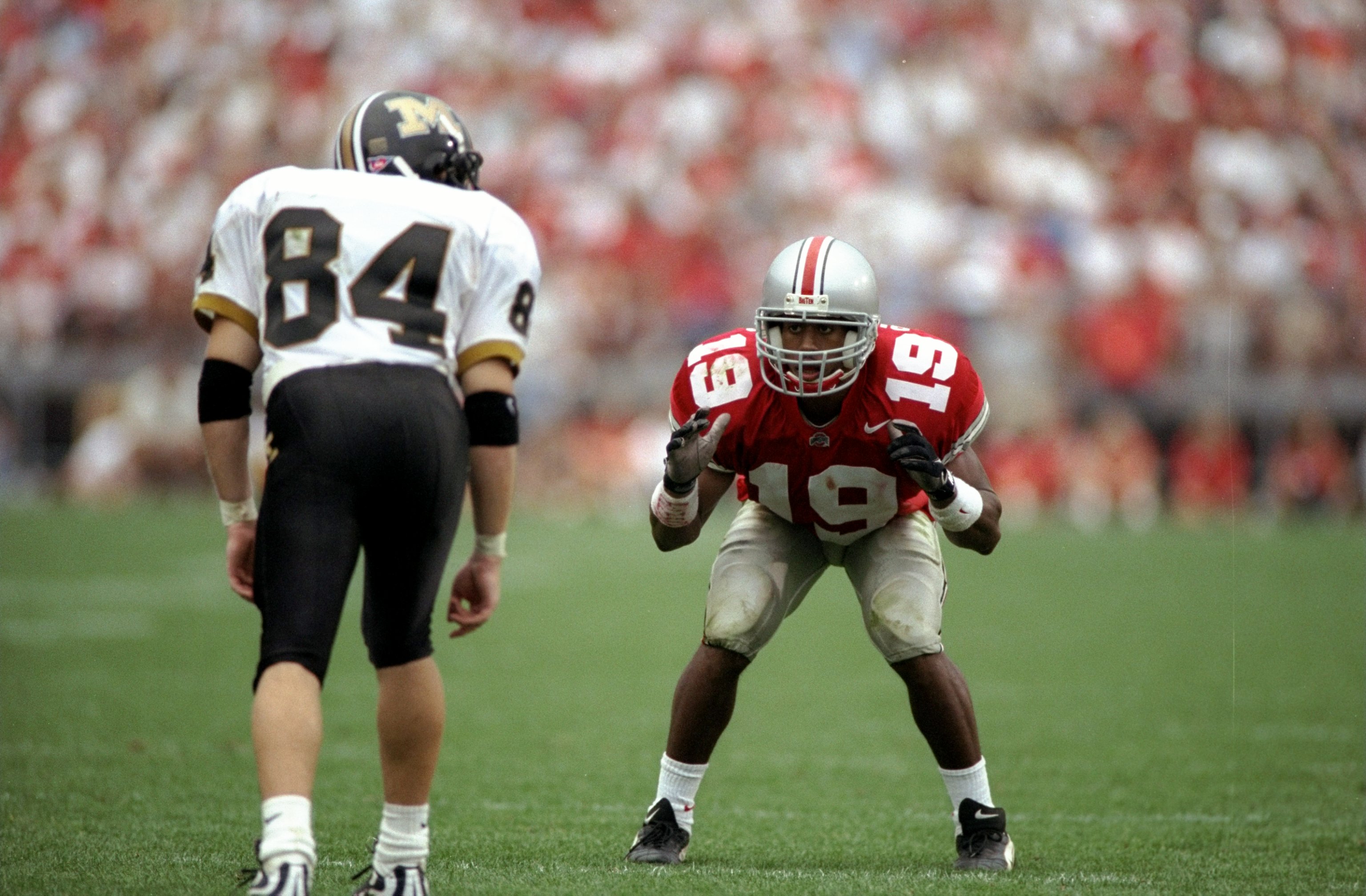 19 Sep 1998: Cornerback Ahmed Plummer #19 of the Ohio State Buckeyes in action against wide receiver Kent Layman #84 of the Missouri Tigers during the game at the Ohio Stadium in Columbus, Ohio. The Buckeyes defeated the Tigers 35-14. Mandatory Credit: M