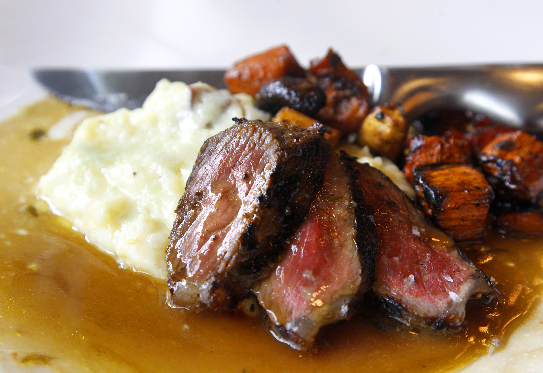 Cooperâs Hawk Winery & Restaurant, located in the Cornerstone of Centerville, opens Monday, Aug. 26. Ginger soy glazed center-cut NY strip with wasabi-buttered mashed potatos and oven-roasted vegetables is among the entrees. LISA POWELL / STAFF
