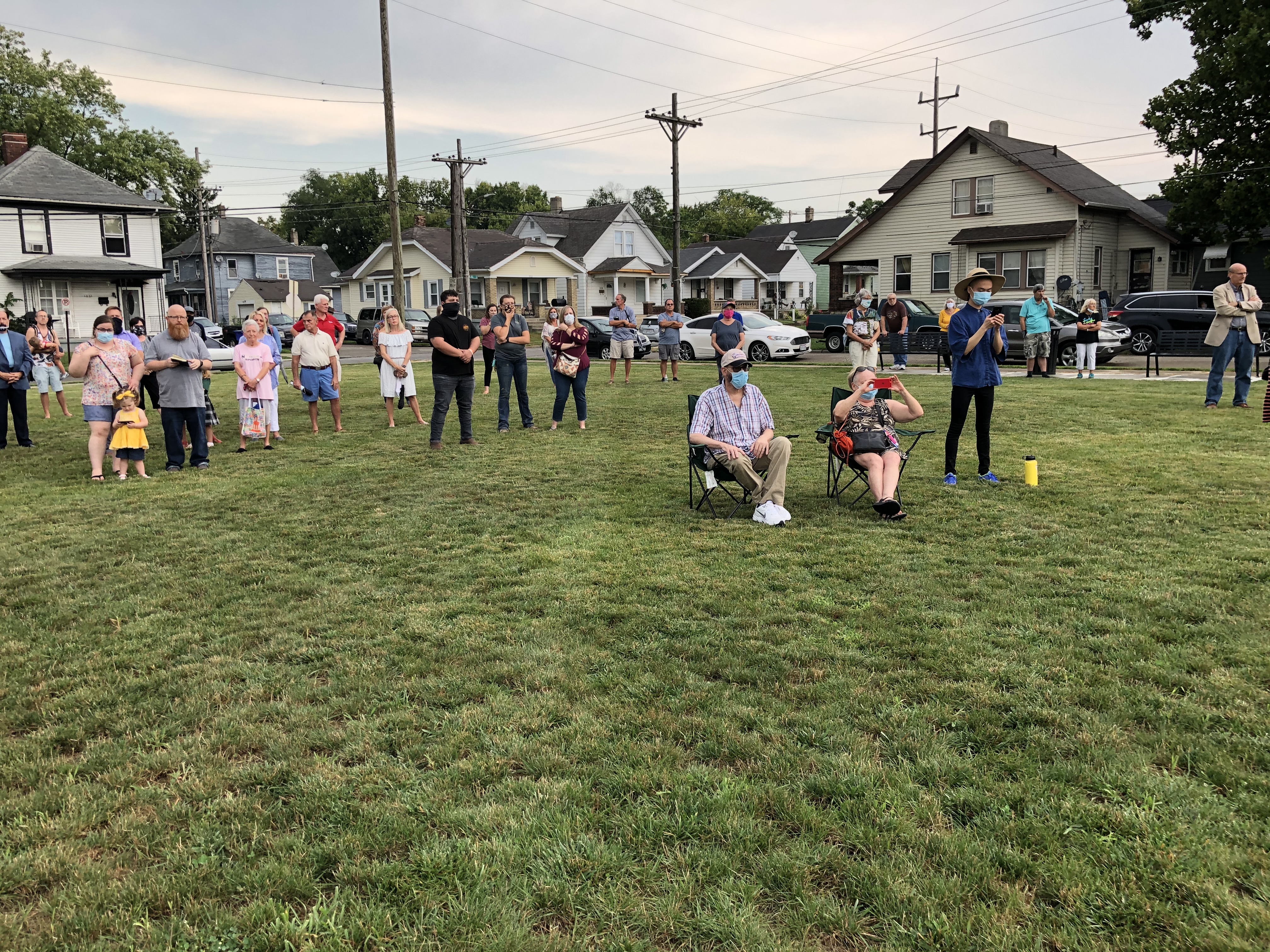 Residents of the Jefferson neighborhood gathered Tuesday to dedicate the new mural, Garden Parade, in the two-year-old Jefferson Park. MIKE RUTLEDGE/STAFF