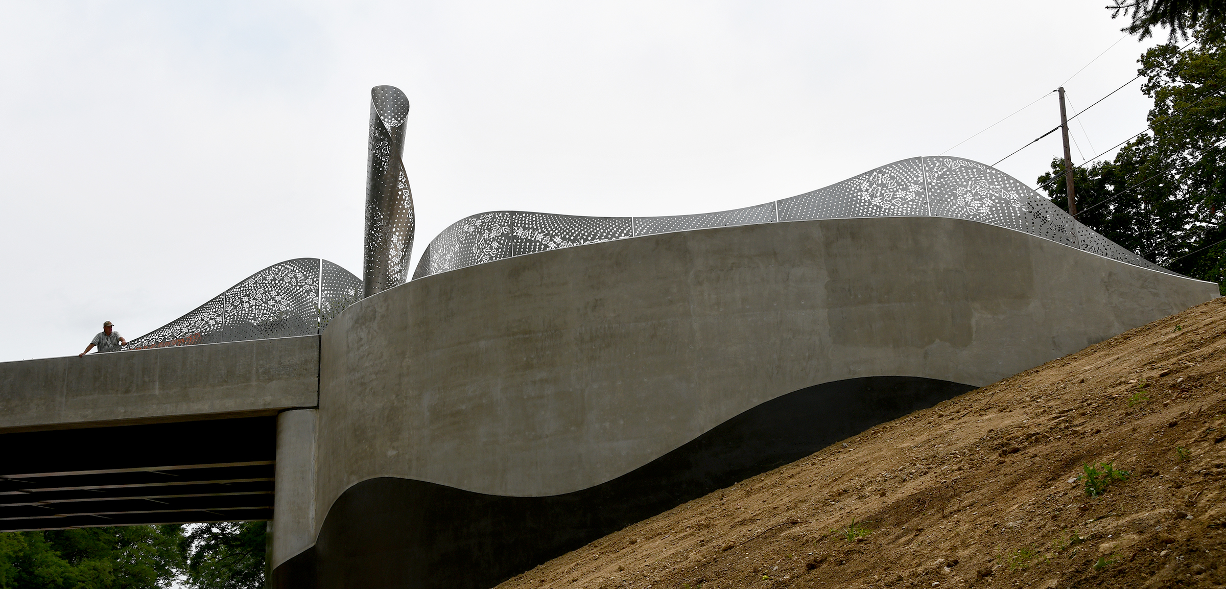 “Foliage,” a new Kettering public artwork, has been installed on the Ridgeway Road bridge. The stainless steel sculpture designed by Cliff Garten Studio in Venice, CA, mimics the landscape found within Hills & Dales MetroPark and Kettering. SHAYNA MCCONVILLE / CITY OF KETTERING
