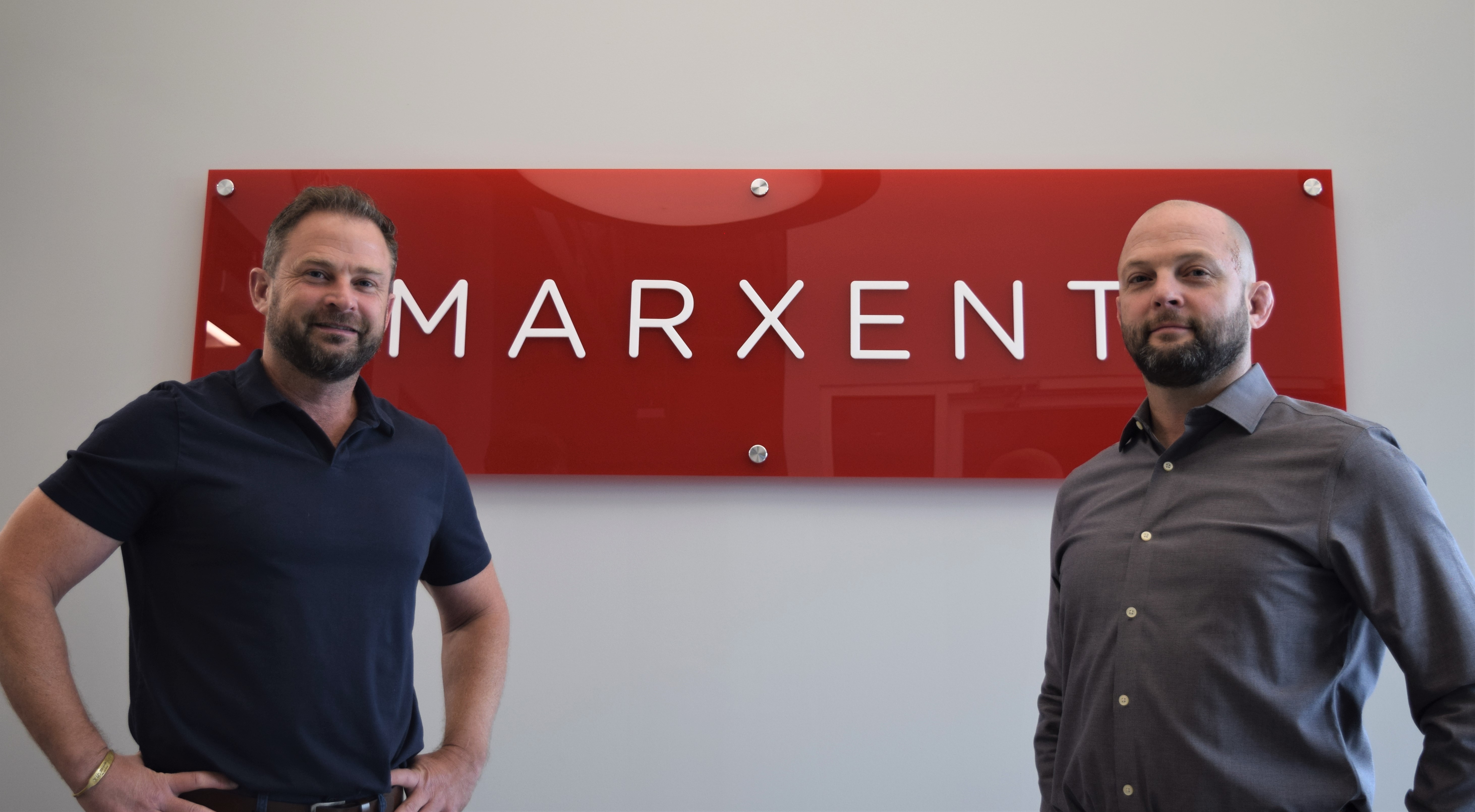 Miamisburg-headquartered Marxent develops software to help consumers visualize furniture at stores like La-Z-Boy and Macy's using augmented and virtual reality. Co-founder and CEO Beck Besecker co-founder and chief technology officer Barry Besecker pose at the Austin Landing office. STAFF PHOTO / HOLLY SHIVELY