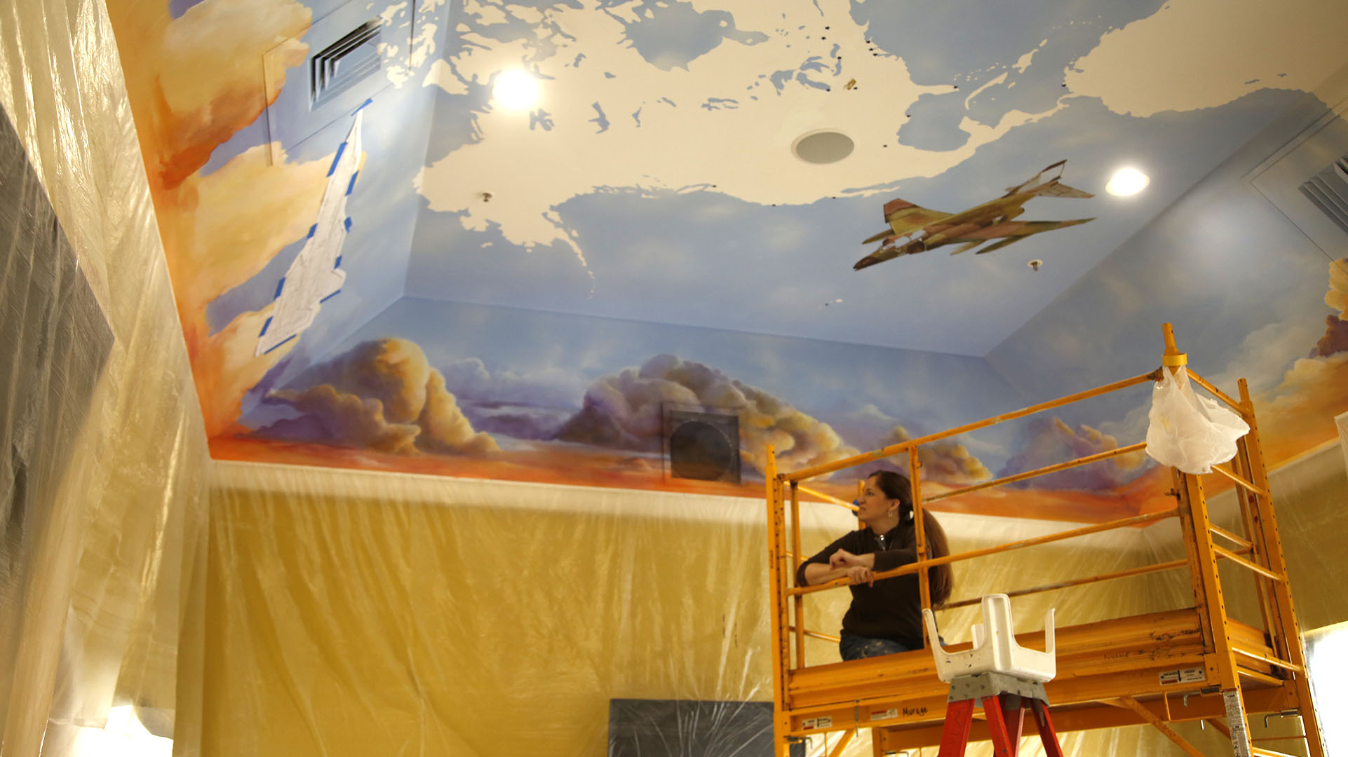 Mural by Jennifer Sayger inside the Frequent Flyer Hall at the new Flyboys Deli in Beaverceek. TY GREENLEES / STAFF