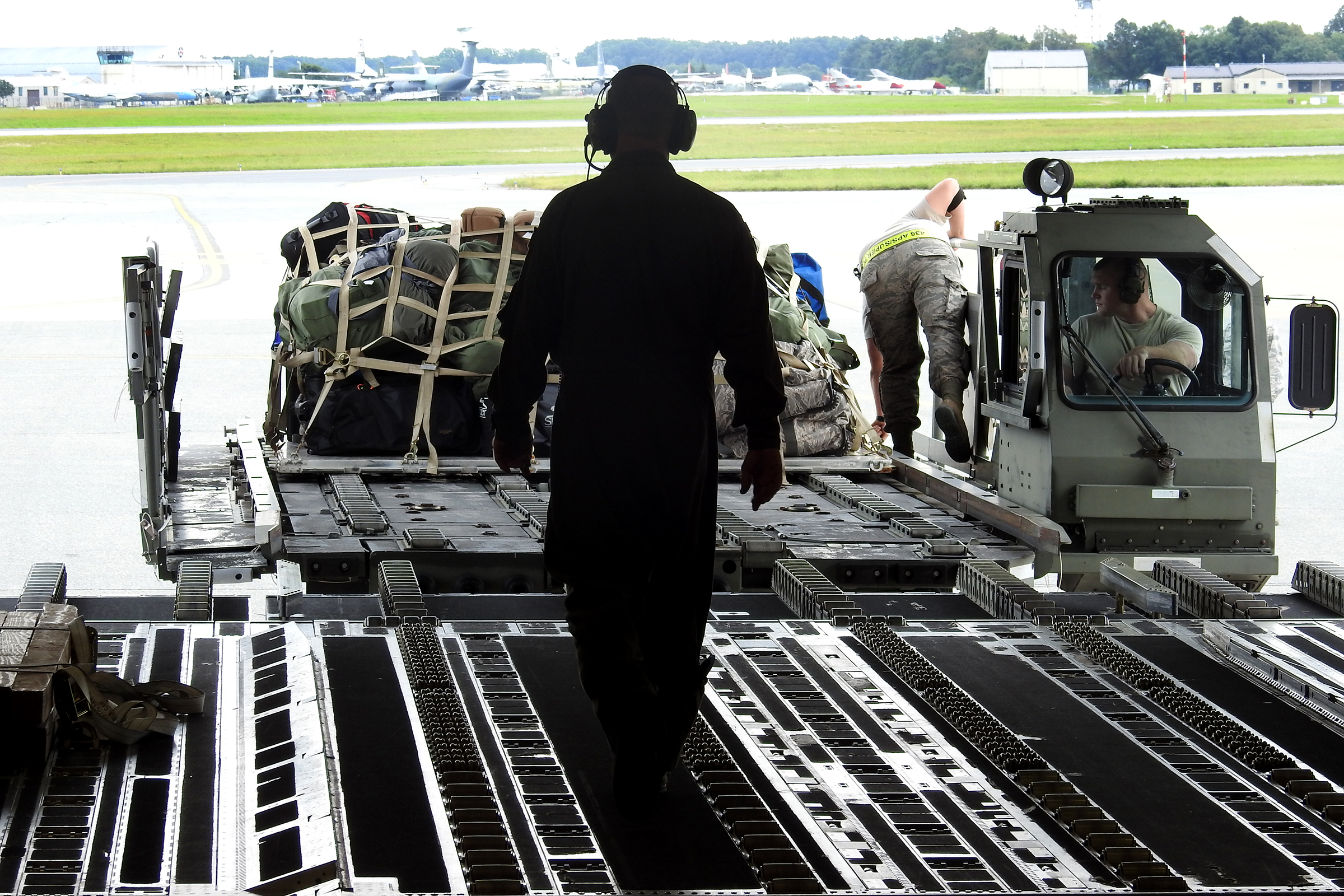 A Wright-Patterson based Air Force Reserve crew loads luggage at Joint Base McGuire-Dix-Lakehurst in New Jersey after picking up troops and supplies to deliver to Florida to assist with Hurricane Irma recovery efforts. BOB GARLOCK / STAFF