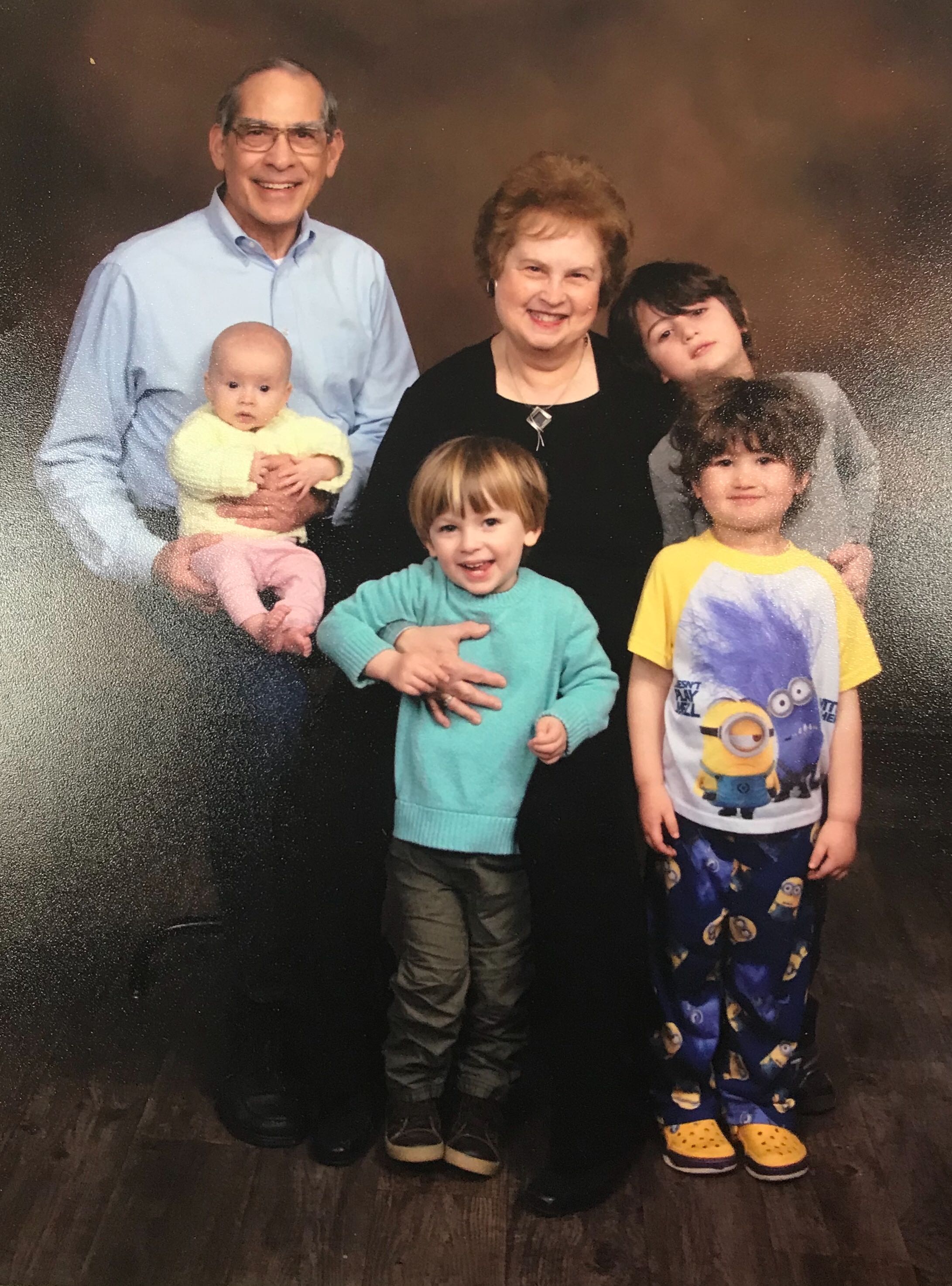 Meredith Moss with her husband Jim Levinson and four grandchildren.