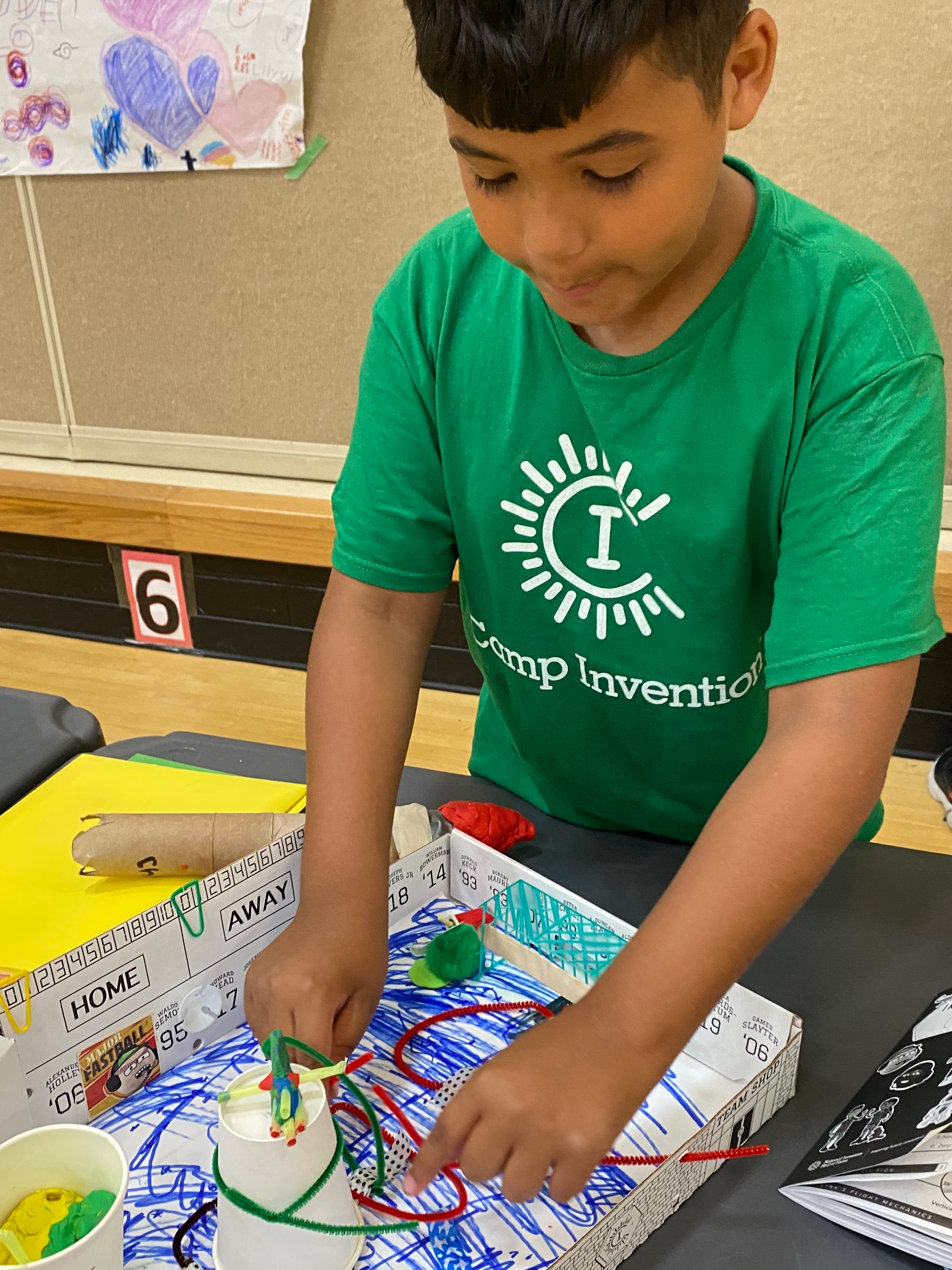 Christian Thomas, an incoming fifth-grader, shows his project through a Huber Heights schools summer camp at Wright Brothers Elementary on July 1. EILEEN McCLORY / STAFF