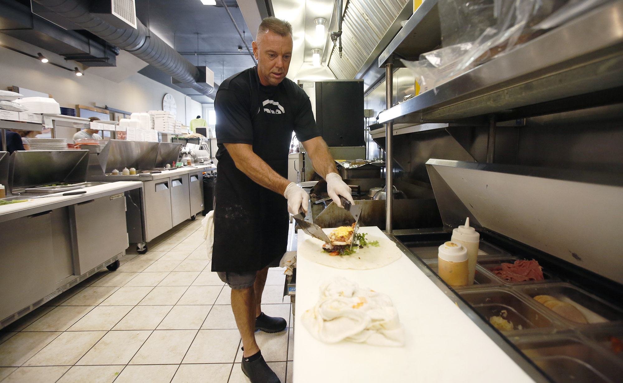 One Bistro chef Greg Shaffer works the lunch shift in Xenia. Shaffer is in long-term recovery from drug and alcohol addiction. TY GREENLEES / STAFF