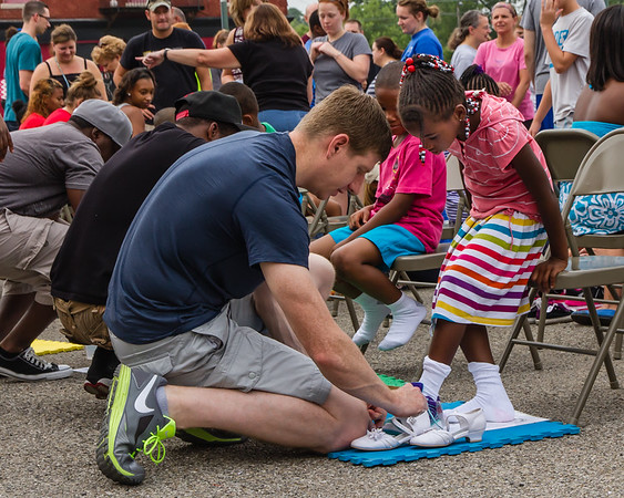 This photo: "Wolf Creek. Shoes for the Shoeless at Mt. Enon Church." Bill Franz, retired engineer and business executive turned professional photographer, has published a collection of photos titled “In the Neighborhood” that is now on exhibition inside the Dayton Metro Library at 215 E. 3rd St. It will be on public display through Sept. 25.