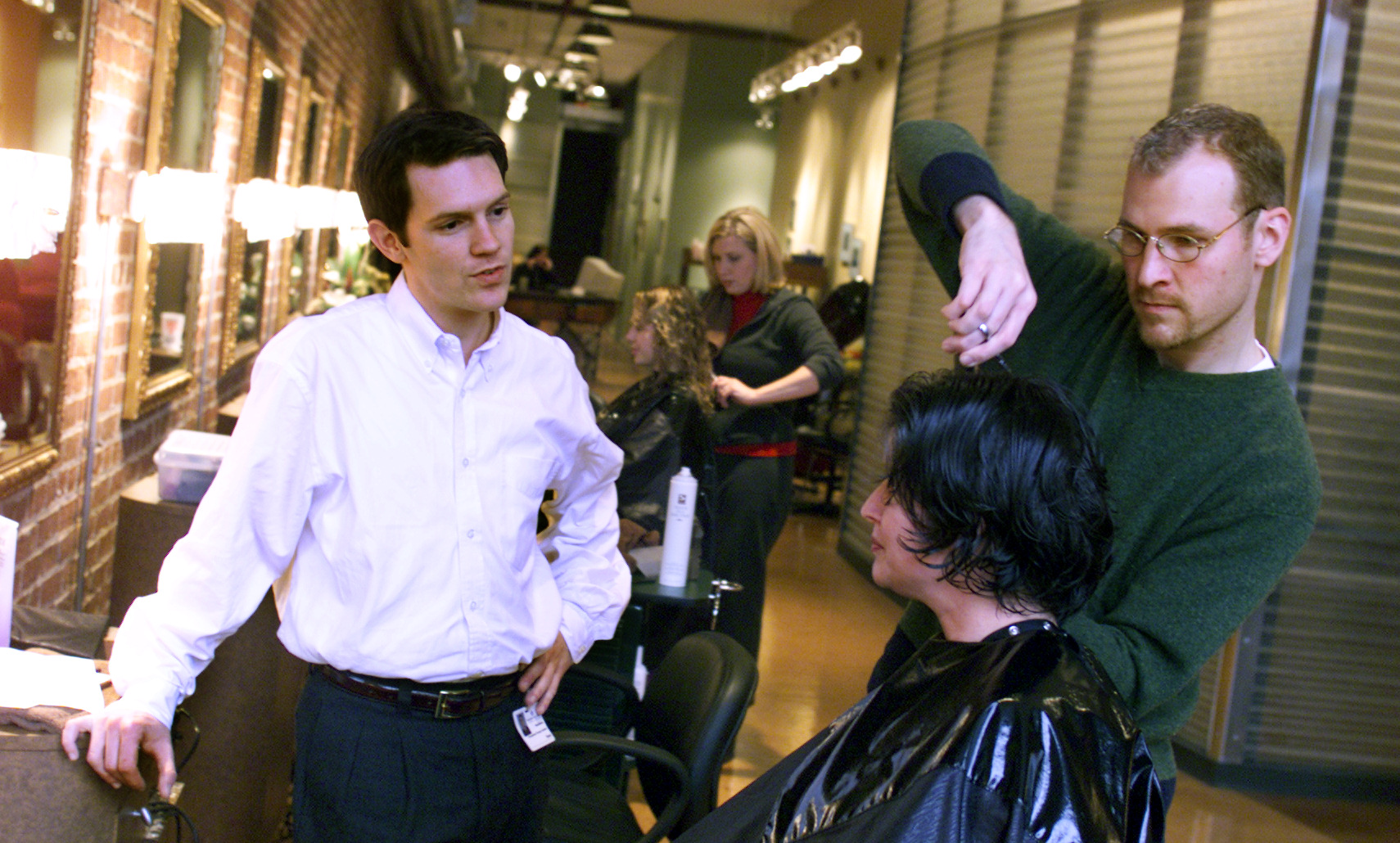 Archived 1999 photo: The Cannery has a new hair salon called the Square One Salon and Spa. Mindy Esmon has her hair cut by one of the owners, Doug Henderson while Brent Johnson (L) looks on. The shop has been open for about five weeks now.