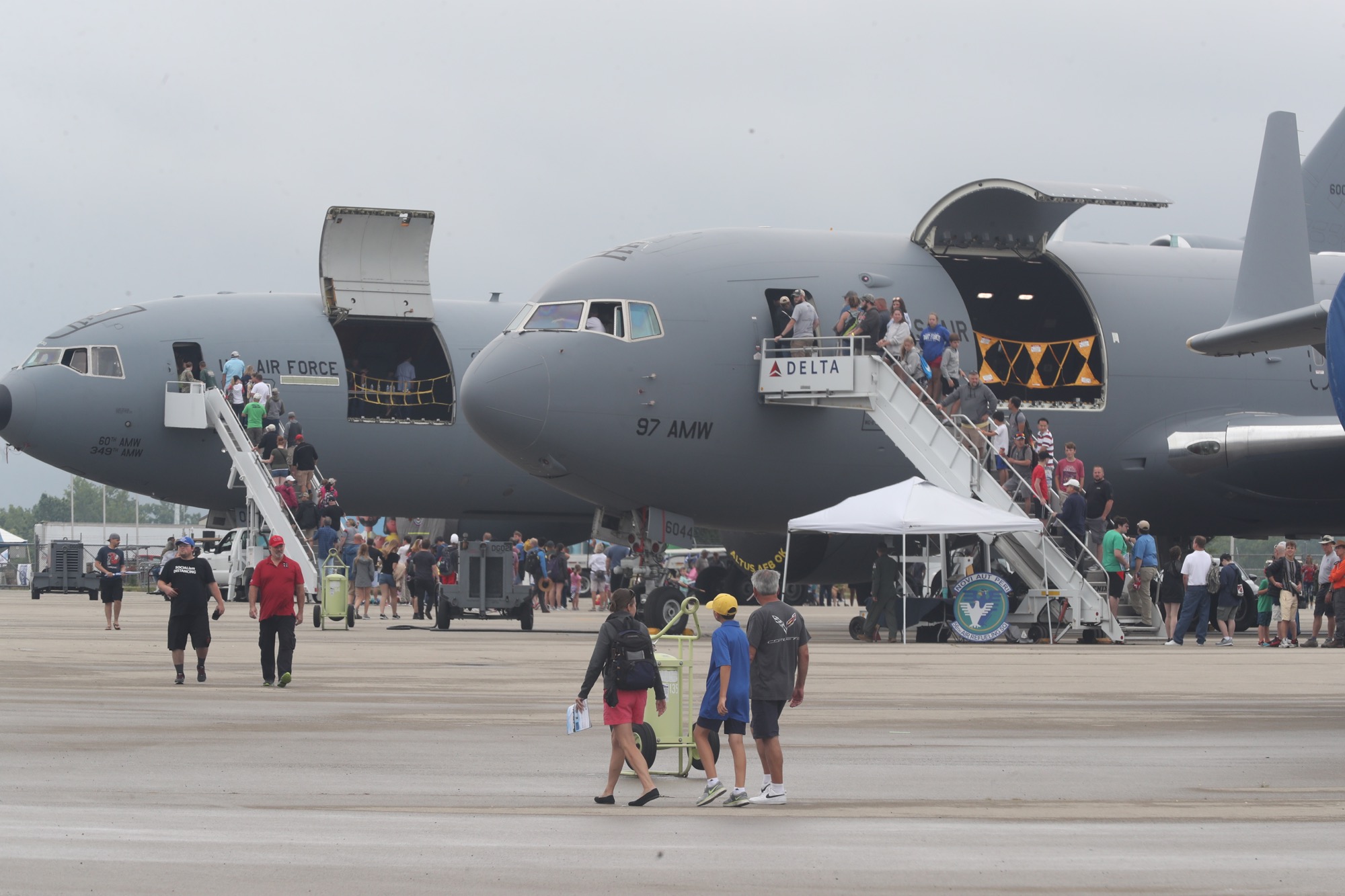 Visitors to the 2021 CenterPoint Dayton Air Show enjoy the static displays and tours of the airplanes on display.  BILL LACKEY/STAFF