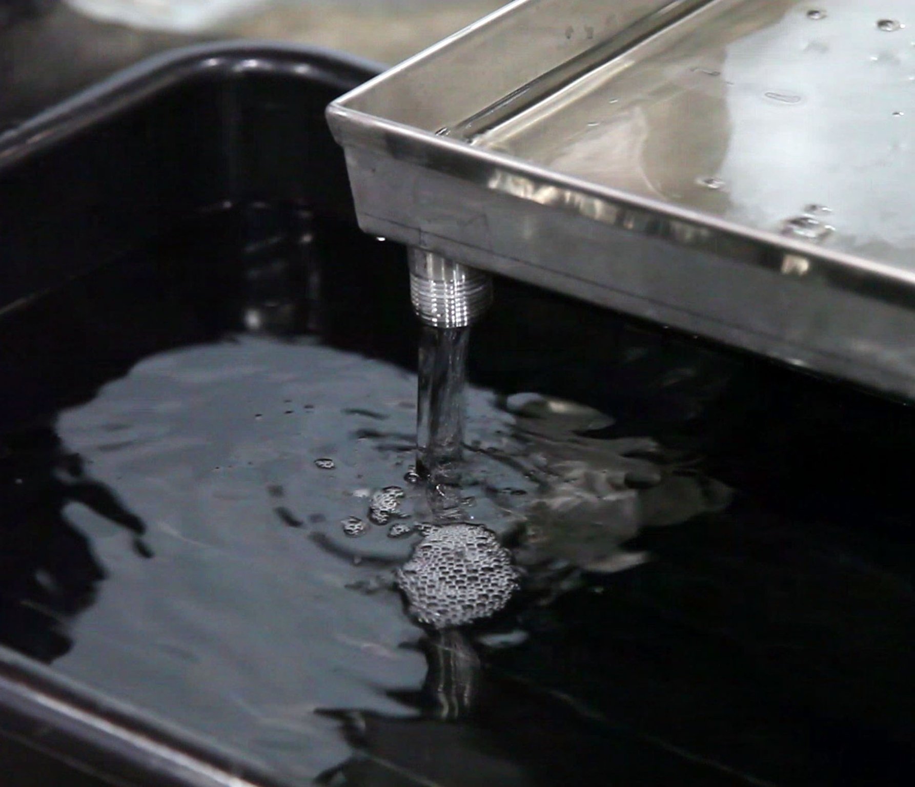 Freshly distilled and filtered Buckeye Vodka flows into a container at the Dayton distillery and warehouse.